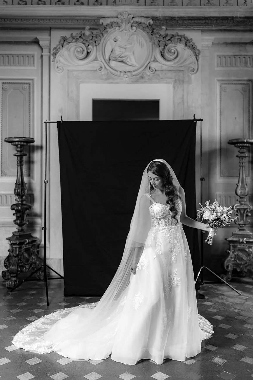 Destination wedding at Castello di Montegufoni in Florence, photo by Rellini art studio documentary wedding photographers in Tuscany. Bride in her dress looking like a model from a fashion magazine
