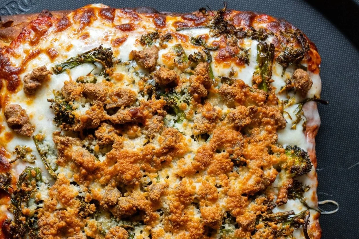 Vodka Alla Sausage: Creamy vodka sauce (vegan available), moz, sausage or housemade vegan sausage, broccolini, grated parm.