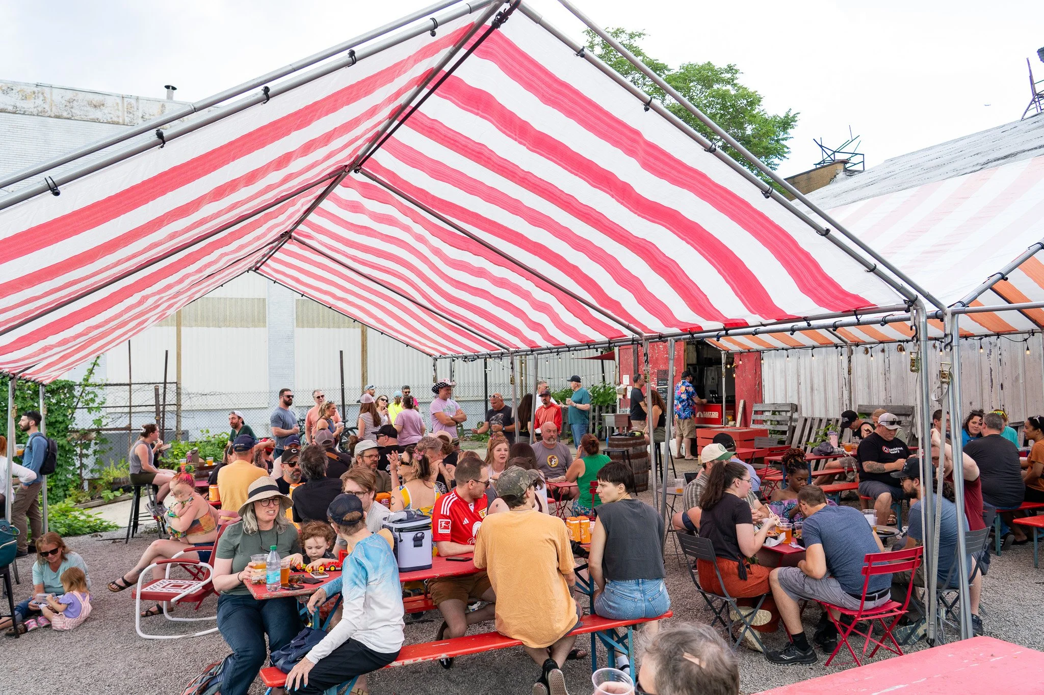 Beer garden tent and guests