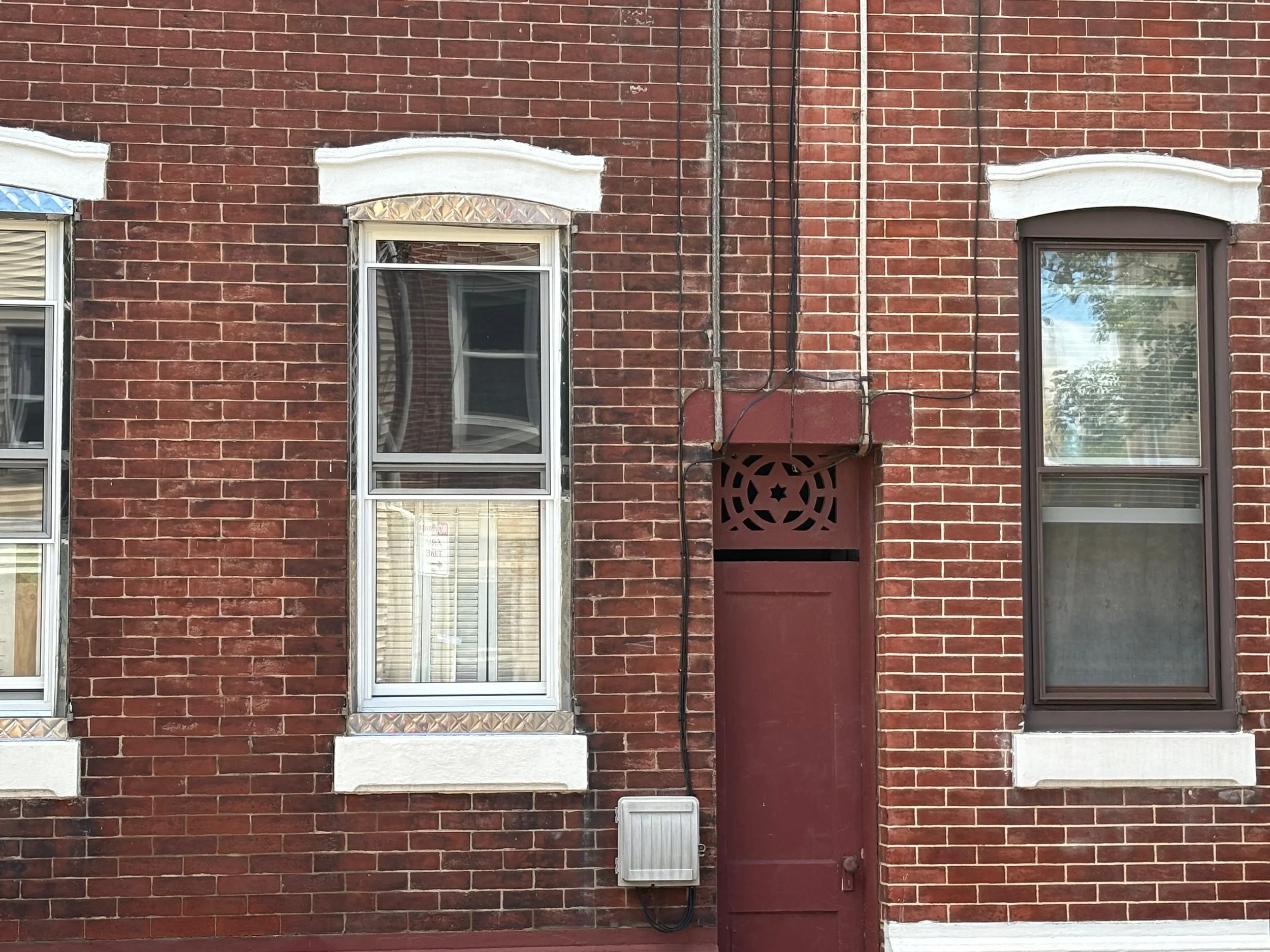 The Star of David (above the doorway) symbolizes connection between God, Israel, the Torah, and people. The seven spaces represent the seven virtues: kindness, severity, harmony, perseverance, splendor, foundation, and royalty.     — Rachel Gucwa