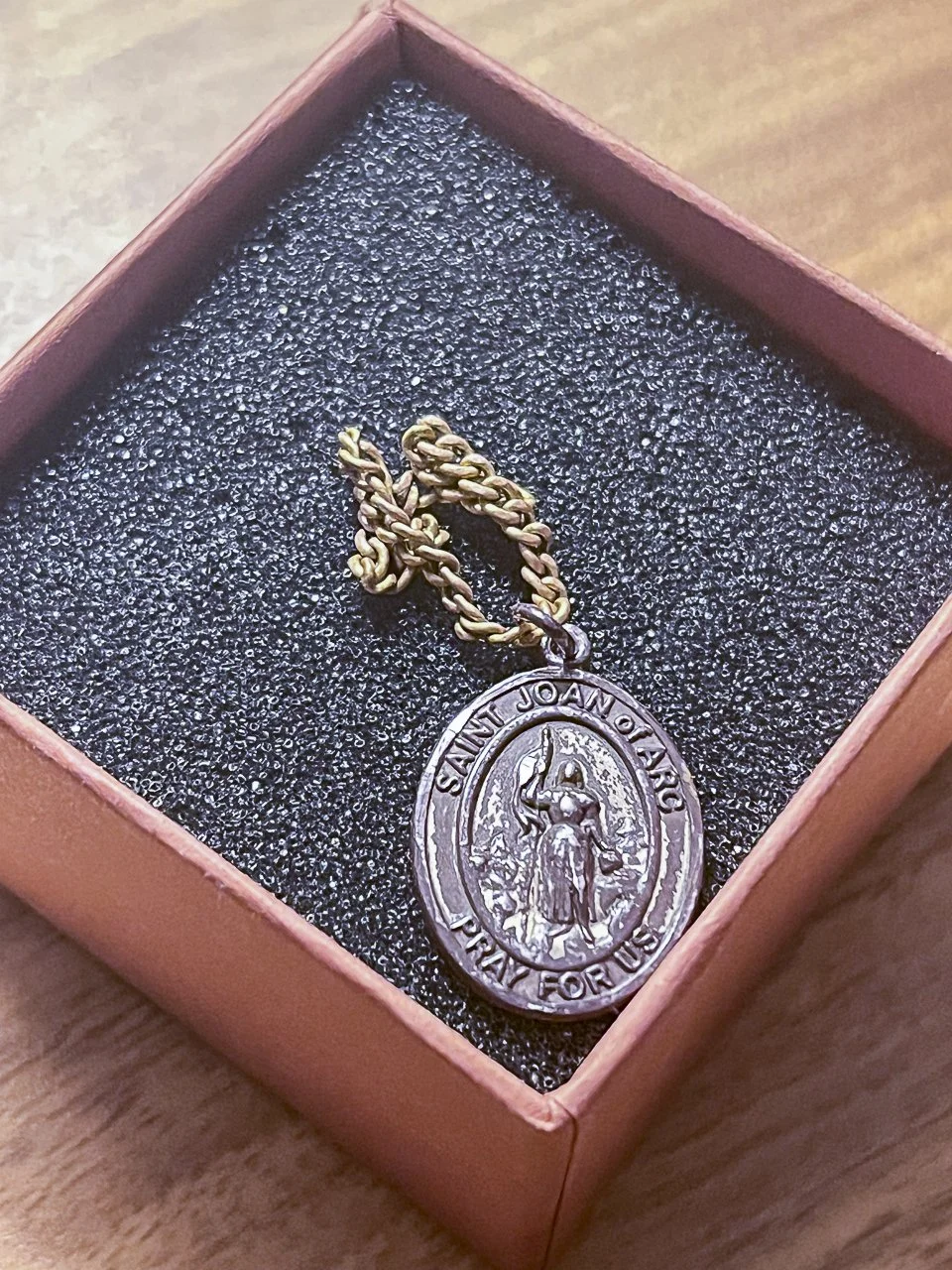"My confirmation saint is St. Joan of Arc, so my confirmation sponsor gave the necklace to me at my-you guessed it-confirmation when I was 14. It's a reminder of how I can emulate St. Joan by following Christ through the challenges that I face, and t
