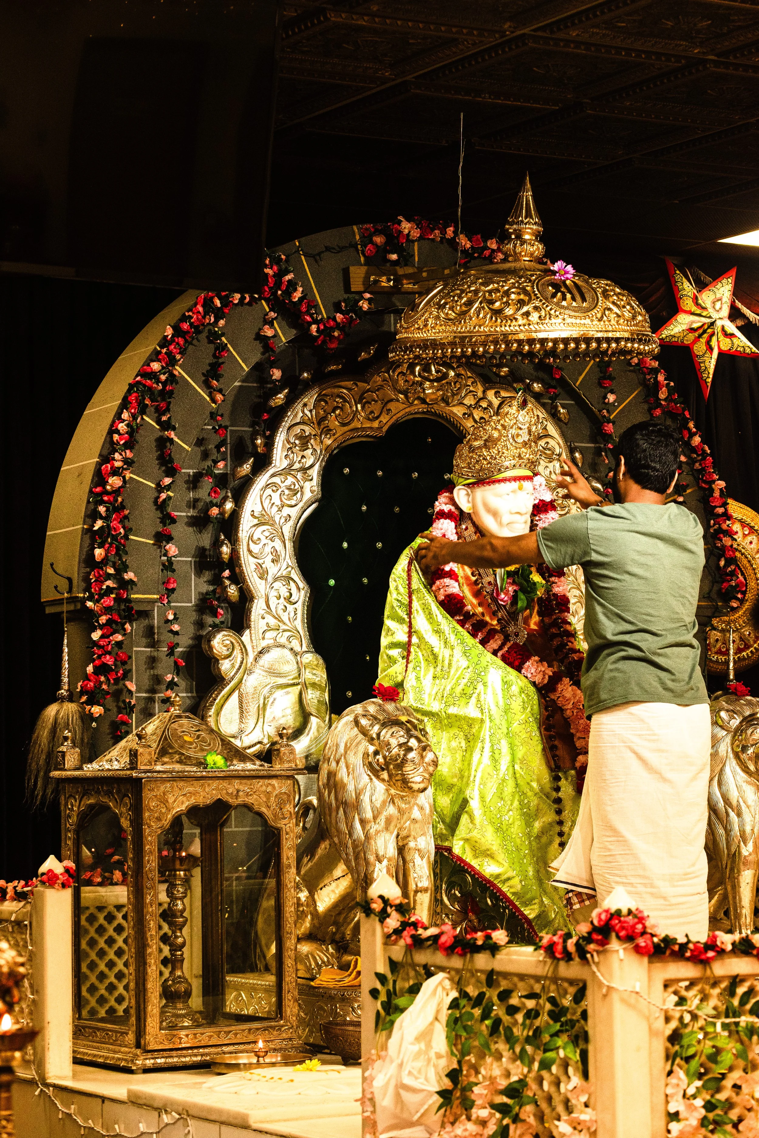 This is the story in itself, where the priest puts the garland on to the God, known as ‘Sai Baba’. This ritual they do every day, every morning and evening for Arti. This is a ritual to groom the God, keeping it more lively, the itar (perfume), the s
