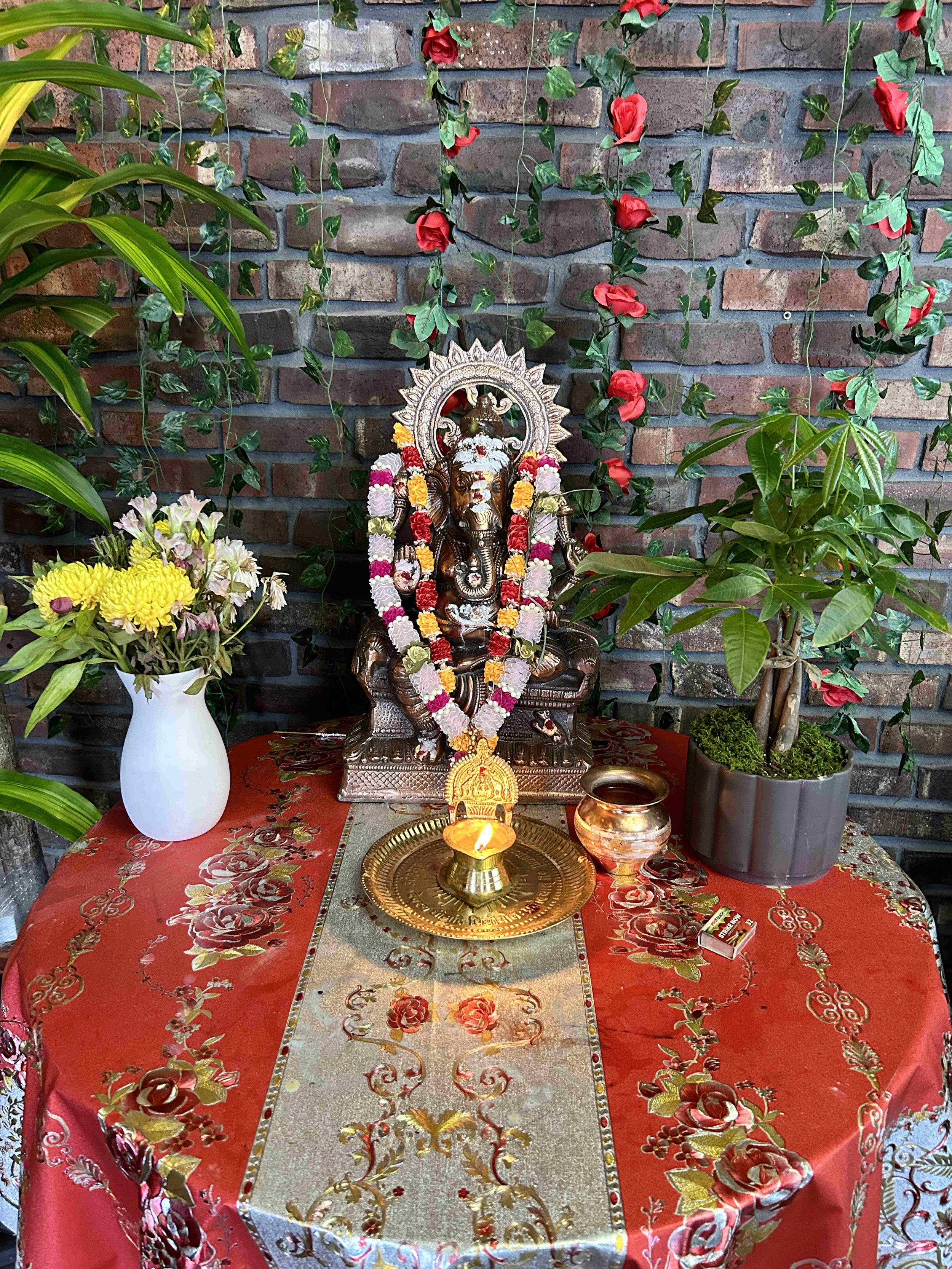 "Lord Ganesha welcoming customers at the entrance of an Indian restaurant in Grand Rapids, Michigan, is a beautiful representation of the cultural significance of this deity in Hinduism. Lord Ganesha, also known as Ganapati or Vinayaka, is the elepha