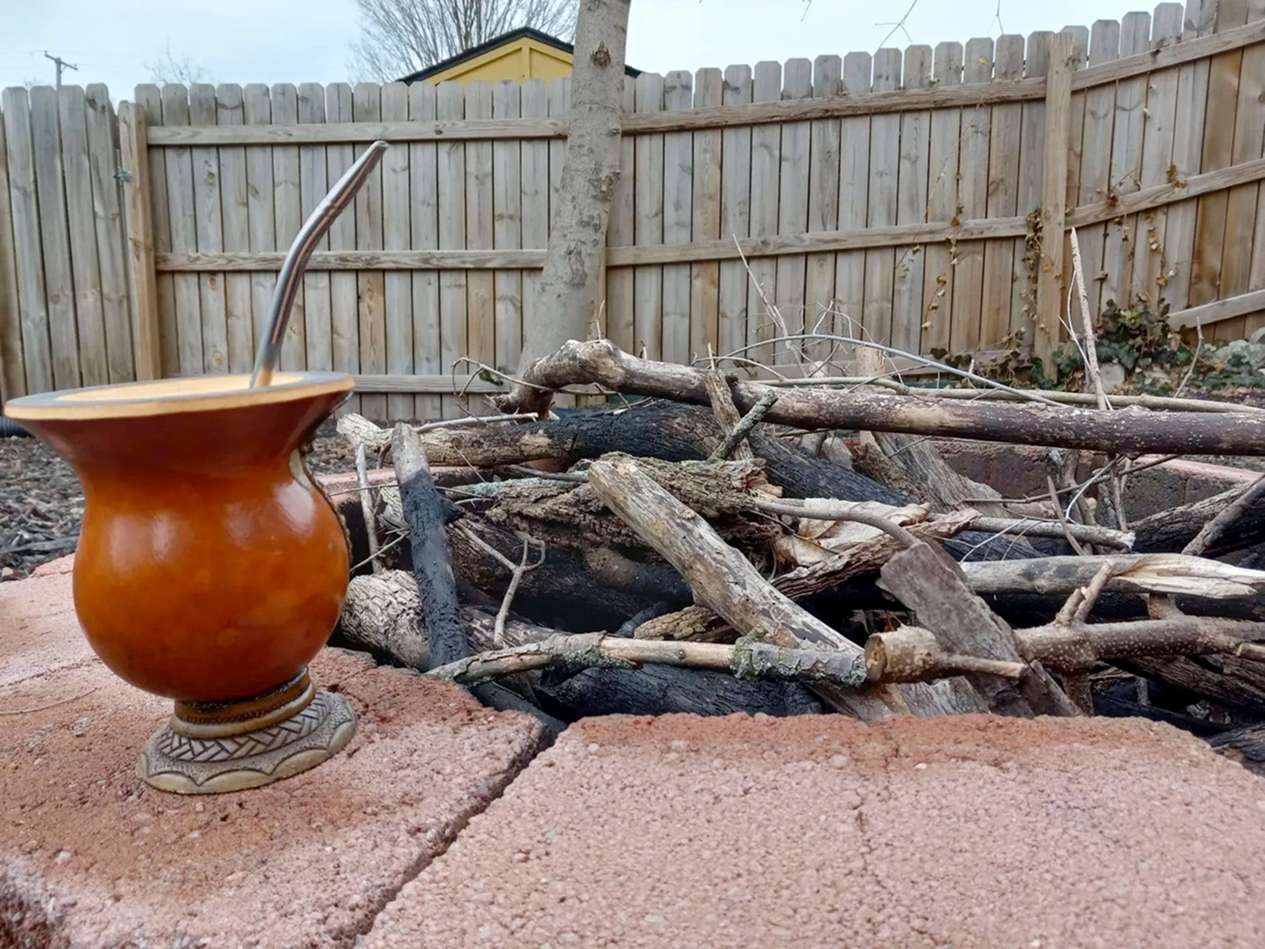 "This is my Chimarrão mug next to my backyard fireplace. Chimarrão is a indigenous tea from my home region of south Brasil; it’s immensely popular and is often shared and passed around at parties and other gatherings. For me, it represents what I mos