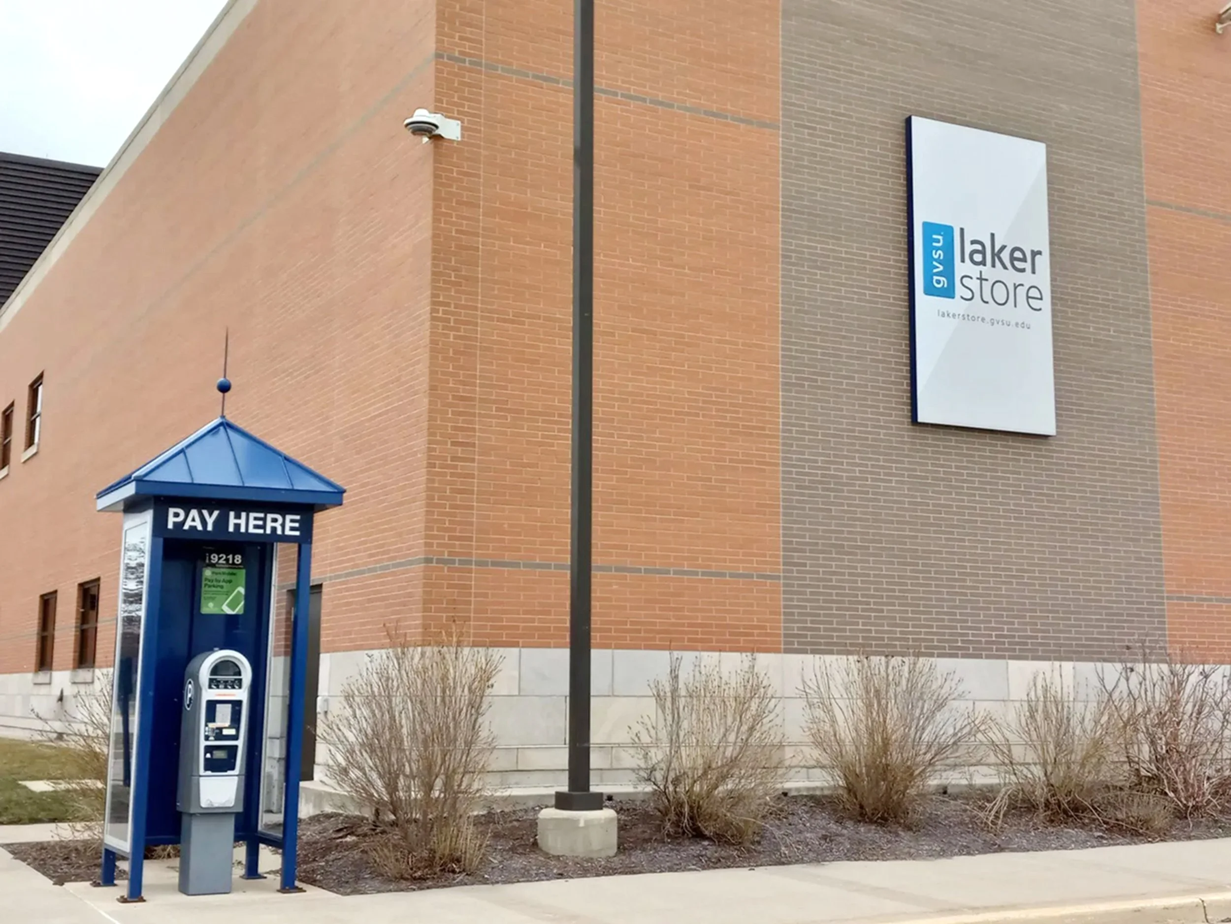 "Many of you will recognize GVSU’s Laker store and the kiosk to pay for campus parking. For me, this photo represents why I’ve struggled to really feel like I belong to any sort of broader GVSU community and why campus has always felt slightly hostil