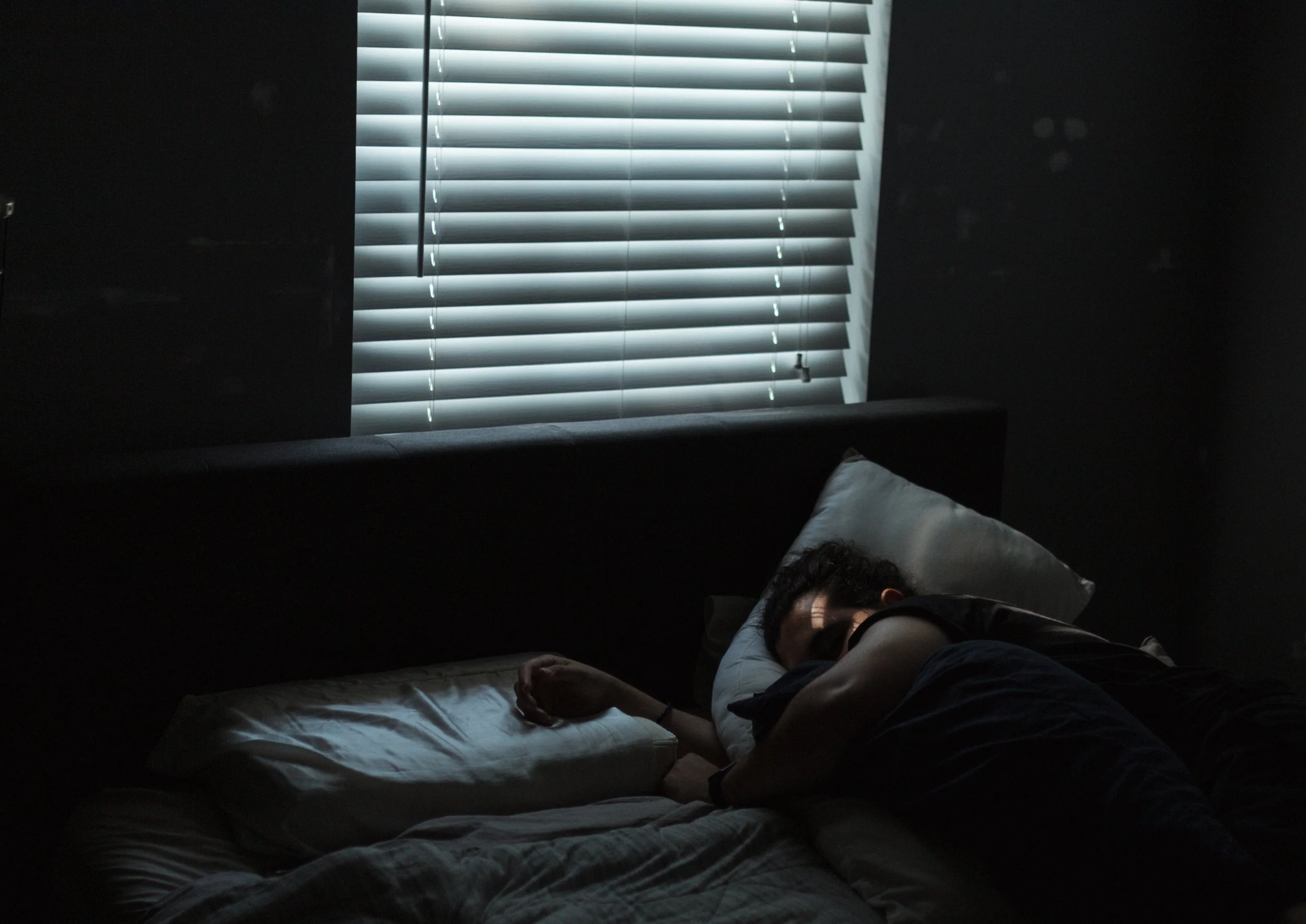 [My husband is] actually sick in bed in this photograph right here. And that kind of spoke to me just because the light was coming in on his face and I just thought it was a beautiful moment of, because I'd spent the week taking care of him and just 