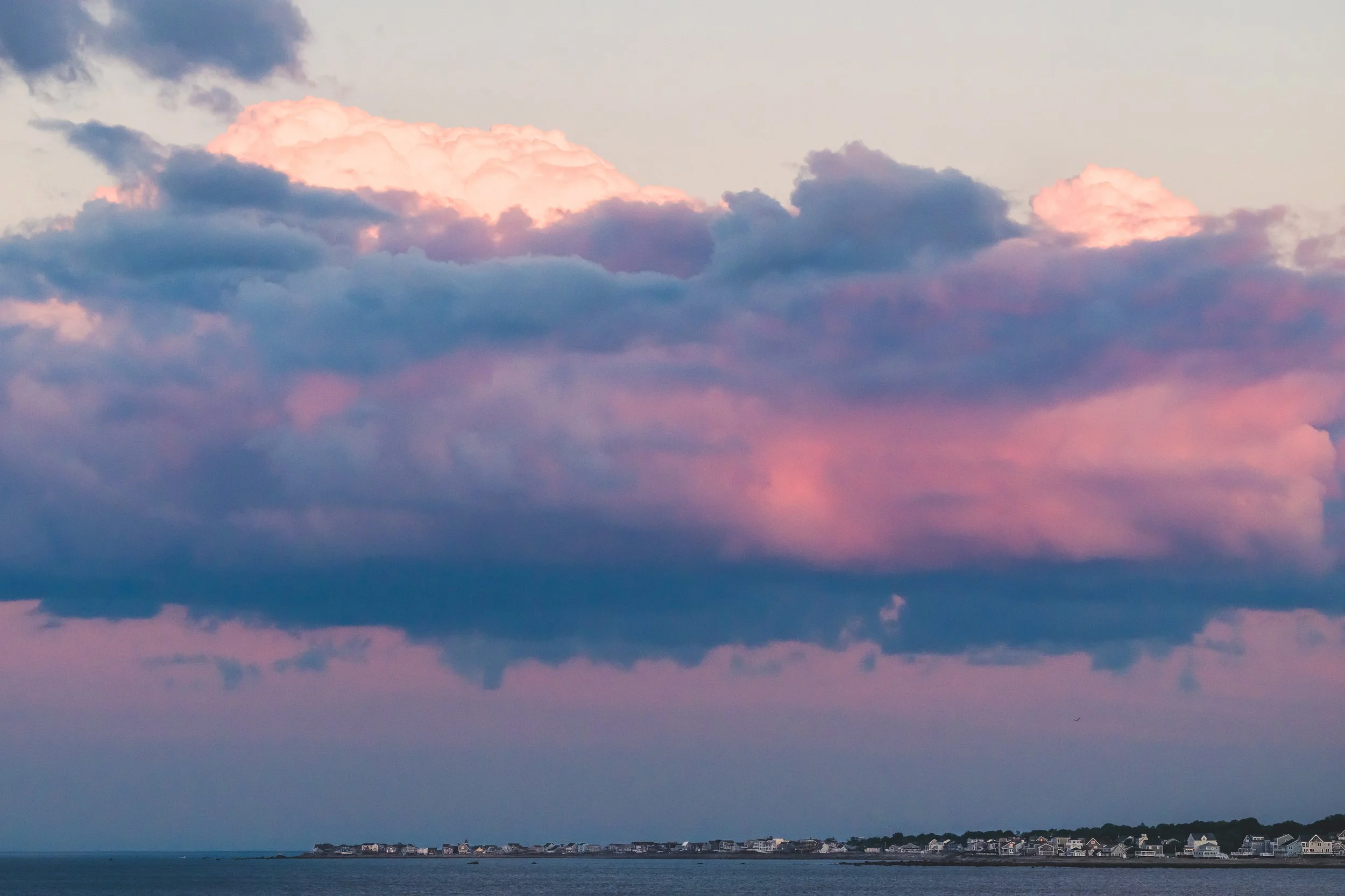 We have phenomenal storm clouds here that'll come in. I love to look up at clouds that will stack up with the sunset light shining on them. It always felt otherworldly. Sacred. And I can see us down below.    

And in this image the light above reall