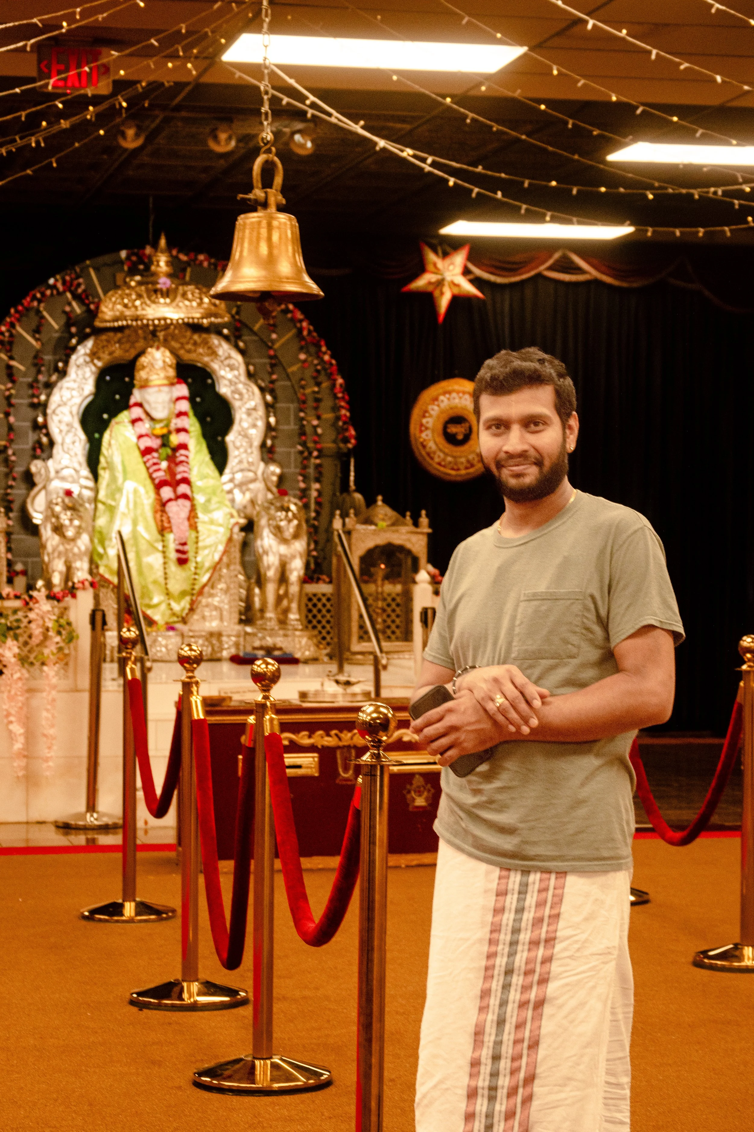 We can see the priest standing there. It is in the Sai Temple that is from Hinduism one of the Gods. This is not my regular temple where I visit. So it was very interesting because when I talked to the priest about why he's a priest, his connection t