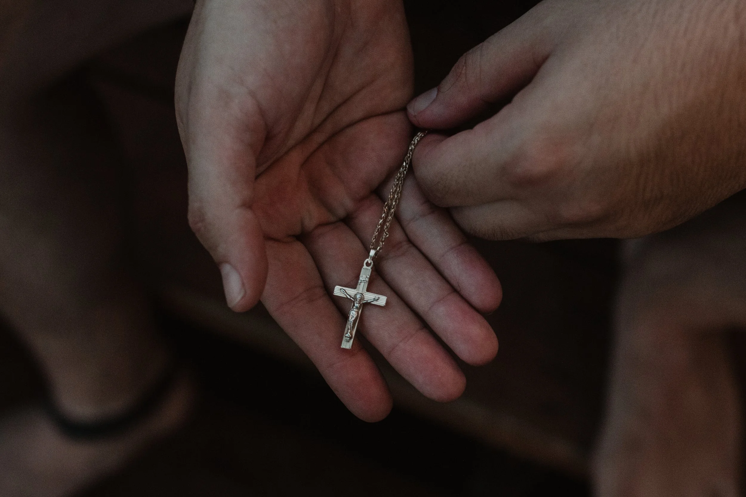 I really see God in hands and people's hands and I just feel like God is reaching towards me or holding me in the palm of his hands. So I wanted to kind of touch on that too and photograph his necklace and his hands.    — Joanna Schaus