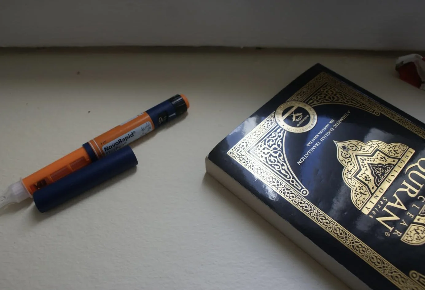 Two things that keep me alive, side by side. My Qur’an and my insulin pen.    — Fatima Zaid