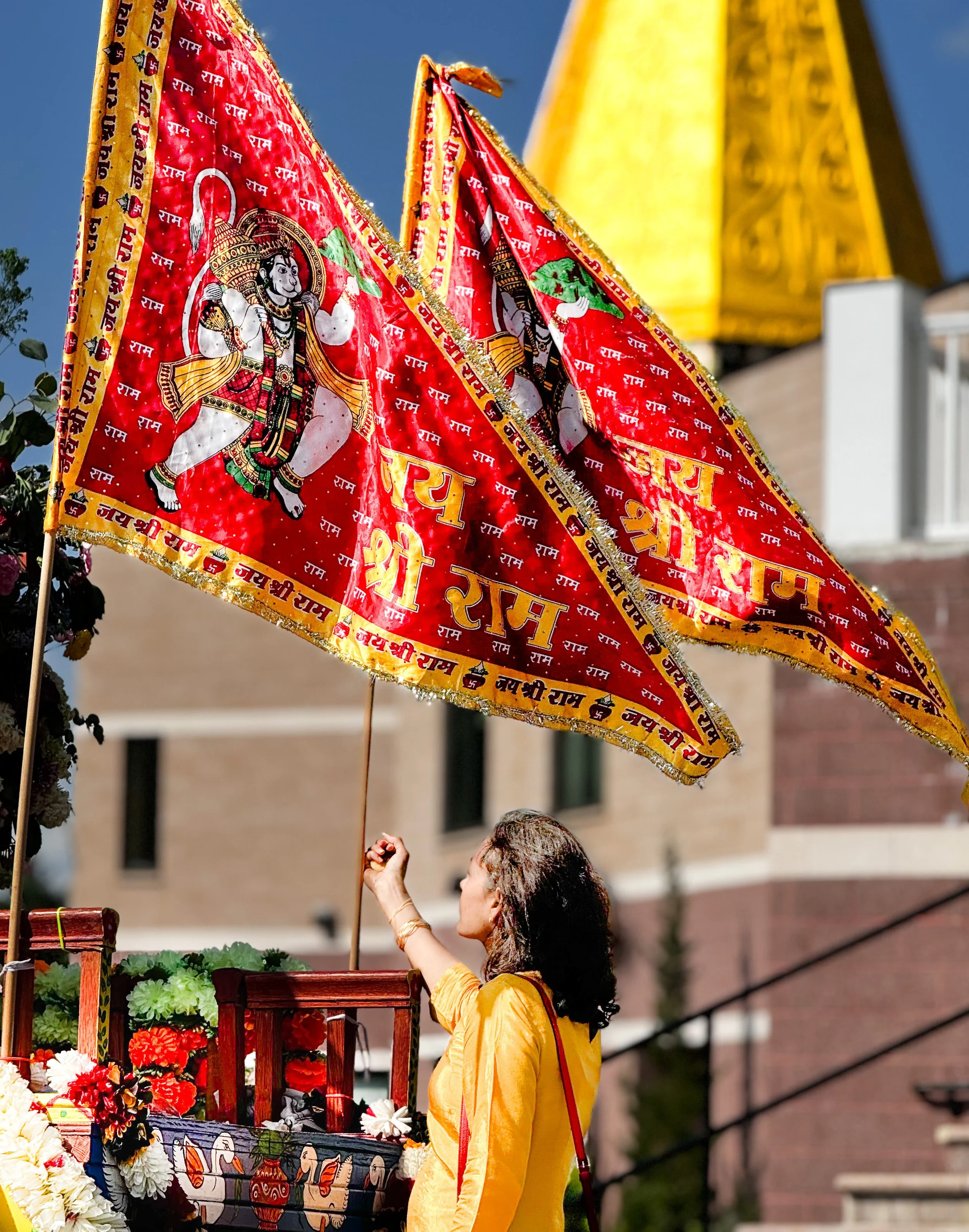 This red flag again is the other prominent symbol of Hindu temple and represents the lord Hanuman. This photo was taken from the  rathyatra, known as the chariot ride of the lord Jagan Nath celebrated entirely in India and USA by people of South Indi