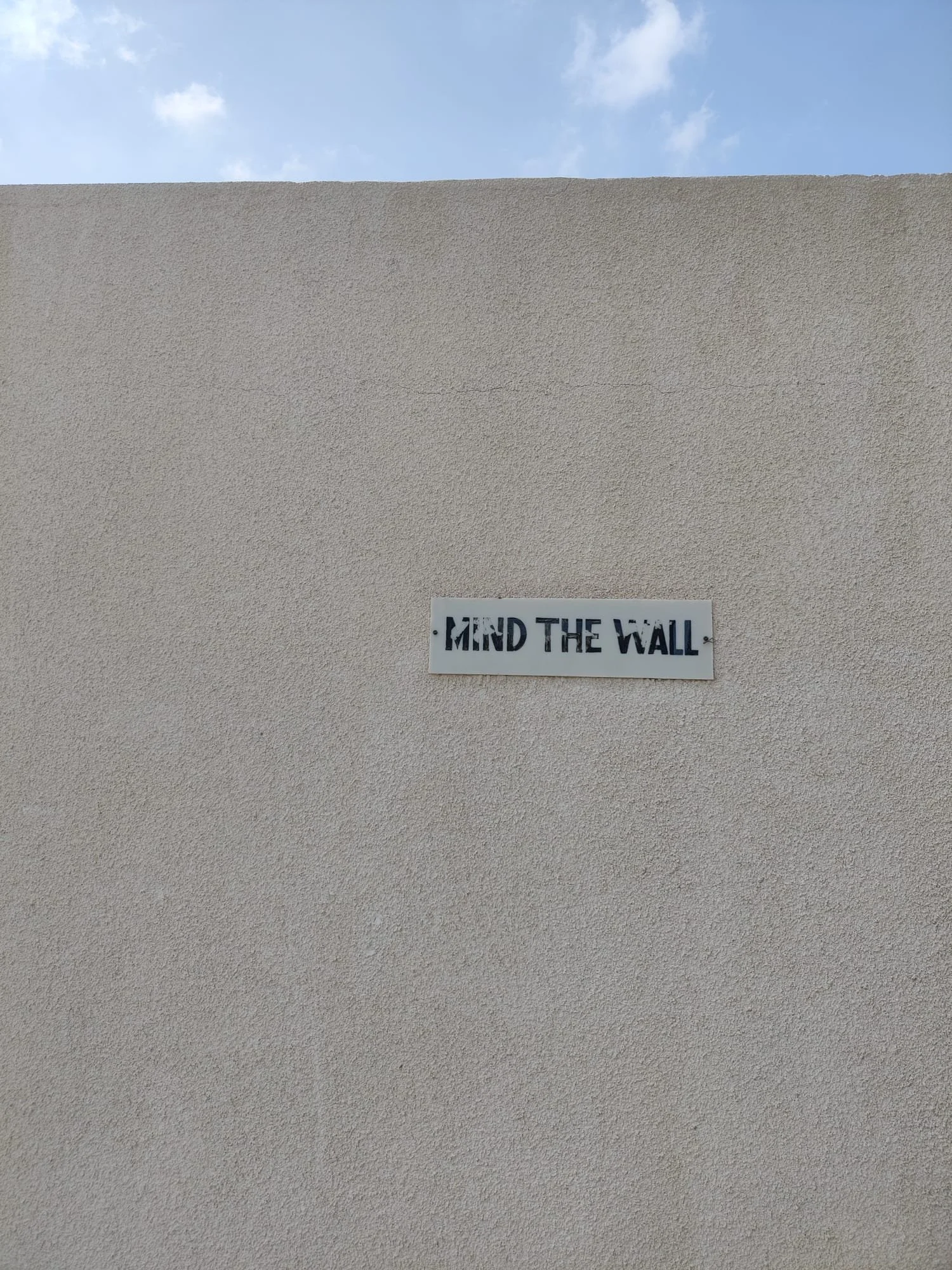 A sing on the wall reminds me of how we need to be mindful of each other’s walls when working across differences. It is what might be hard for the other person, and what in me stands between me and understanding someone else. I’m reminded to mind the