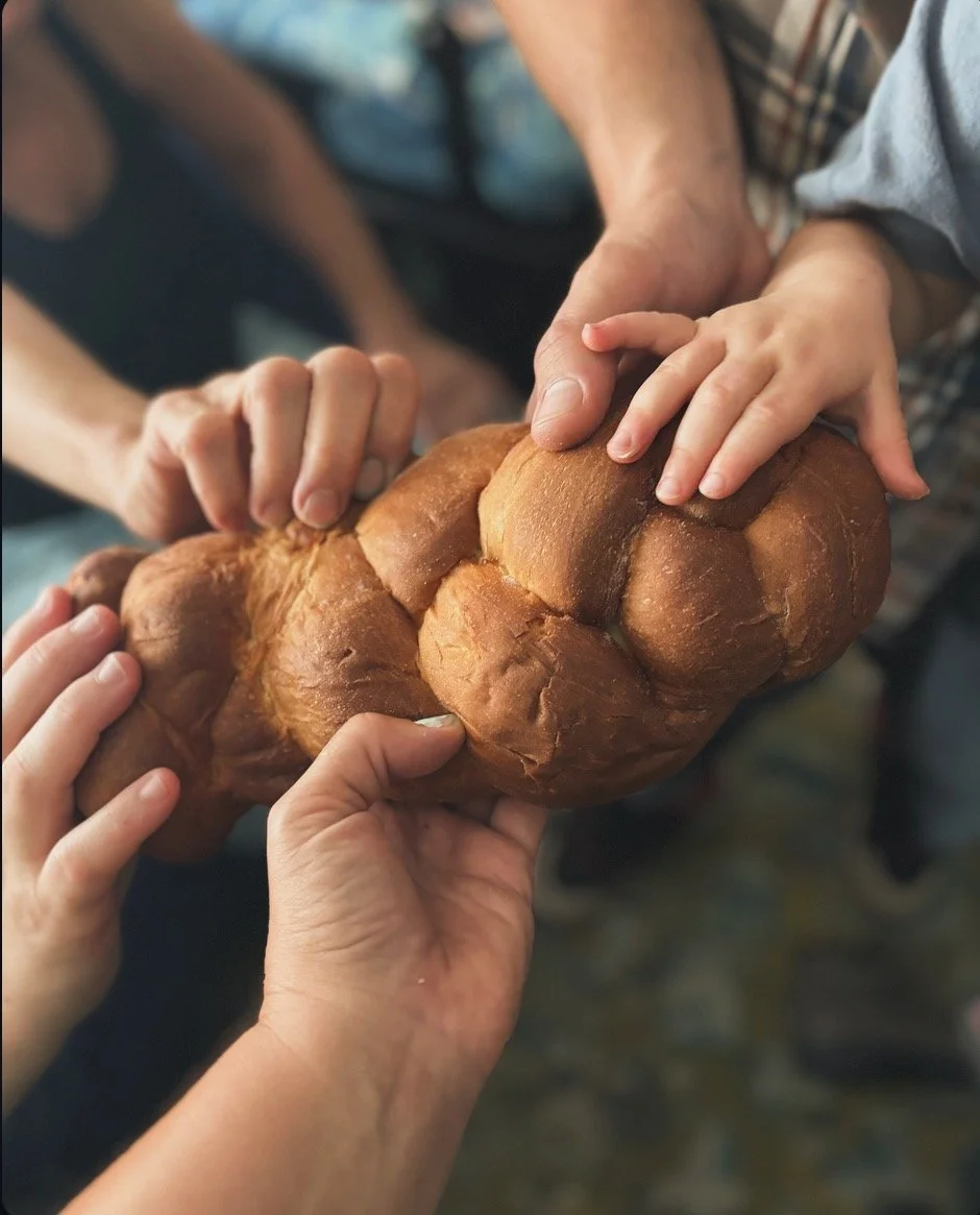 The next picture is a challah bread, and that is the bread you eat on Shabbat. So it's like a special sweet egg bread. And in some traditions you're supposed to touch somebody who's touching the call and it's a way to connect people and build communi