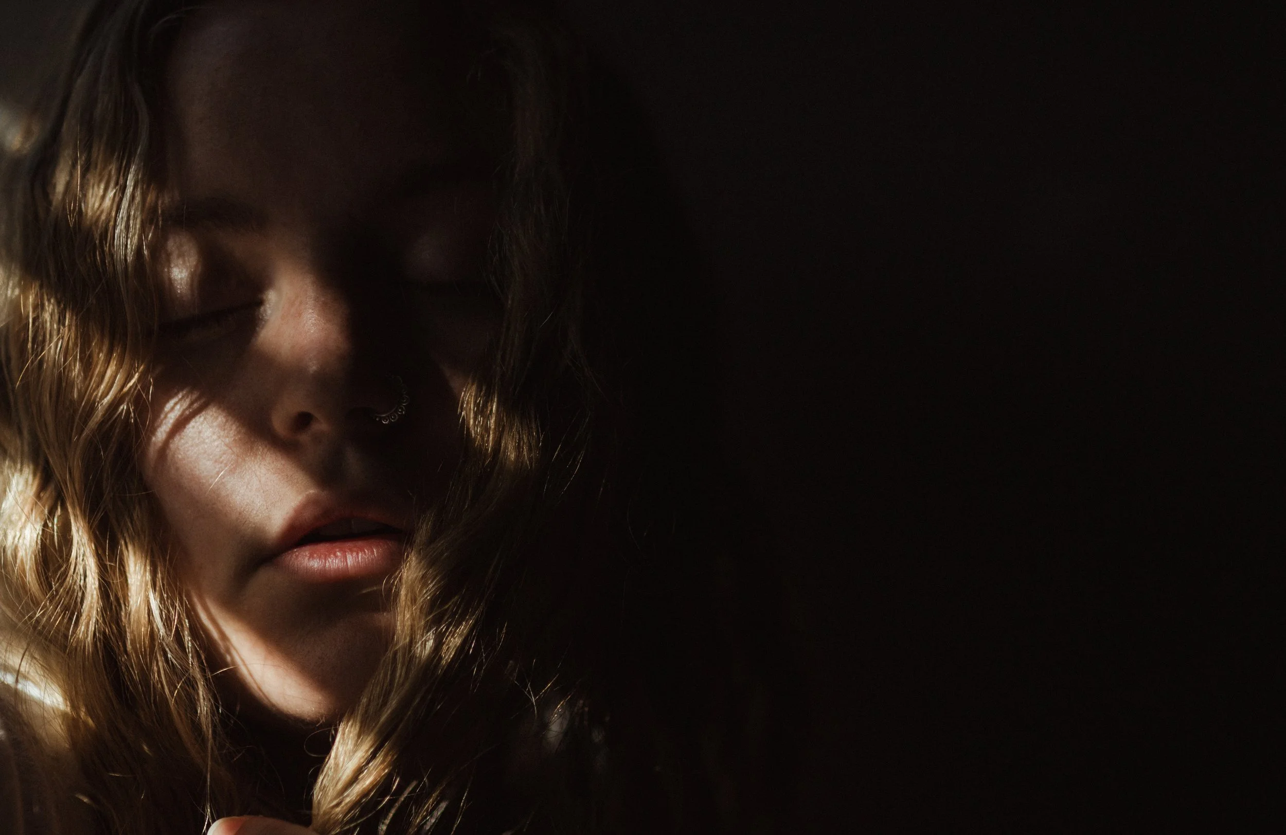 I really wanted to document this idea of light and dark. I think that's kind of been the theme in my own faith story of just searching for the light. And I wasn't even planning on taking these pictures at the top of these self-portraits, but I went i