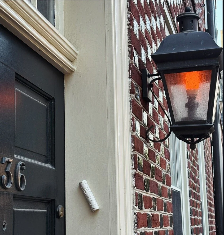 This next picture is this little square on the wall. It's called a mezuzah and it's like a house blessing and a lot of Jewish people have this on the side of their house. And also this picture 36 is a special number in Jewish because any multiple of 