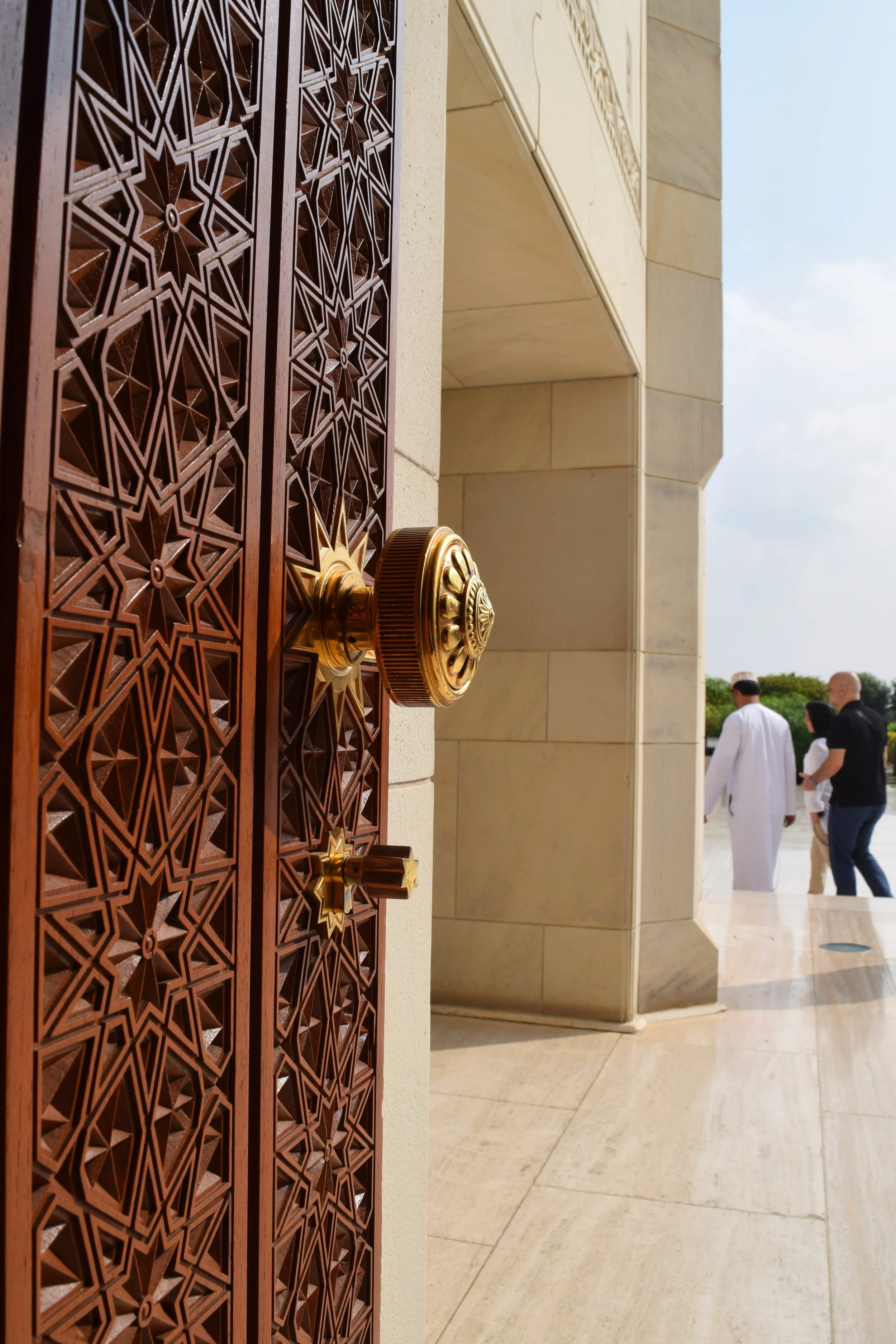Here is a photo that represents cooperation for me. I think the symbolism of the doorway represents being welcomed into the space and you can also see an Omani man giving a tour to people in the background which I believe is a powerful image of how p