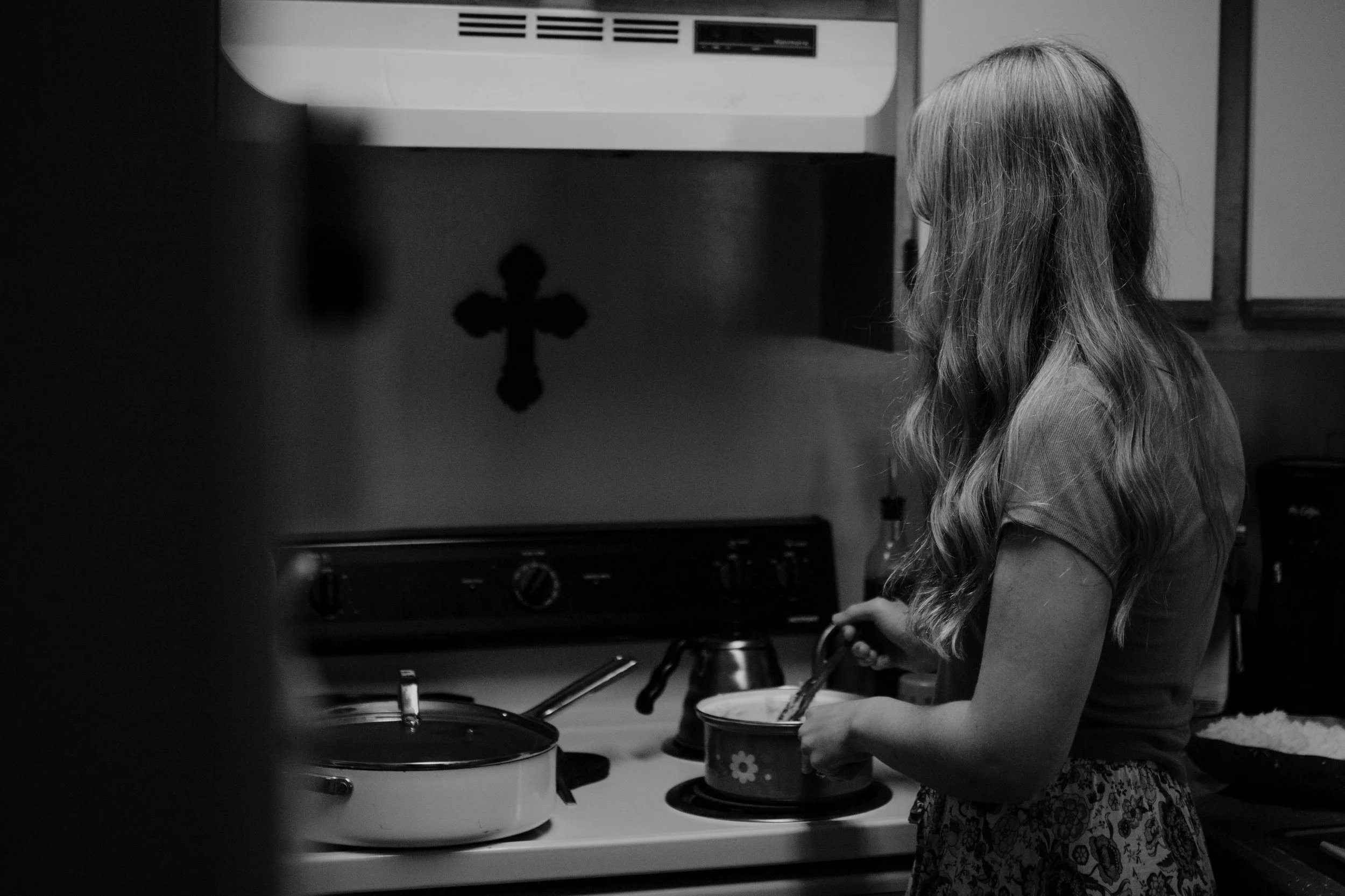 Tessa was making some rice and they have this cross on their wall.     — Joanna Schaus