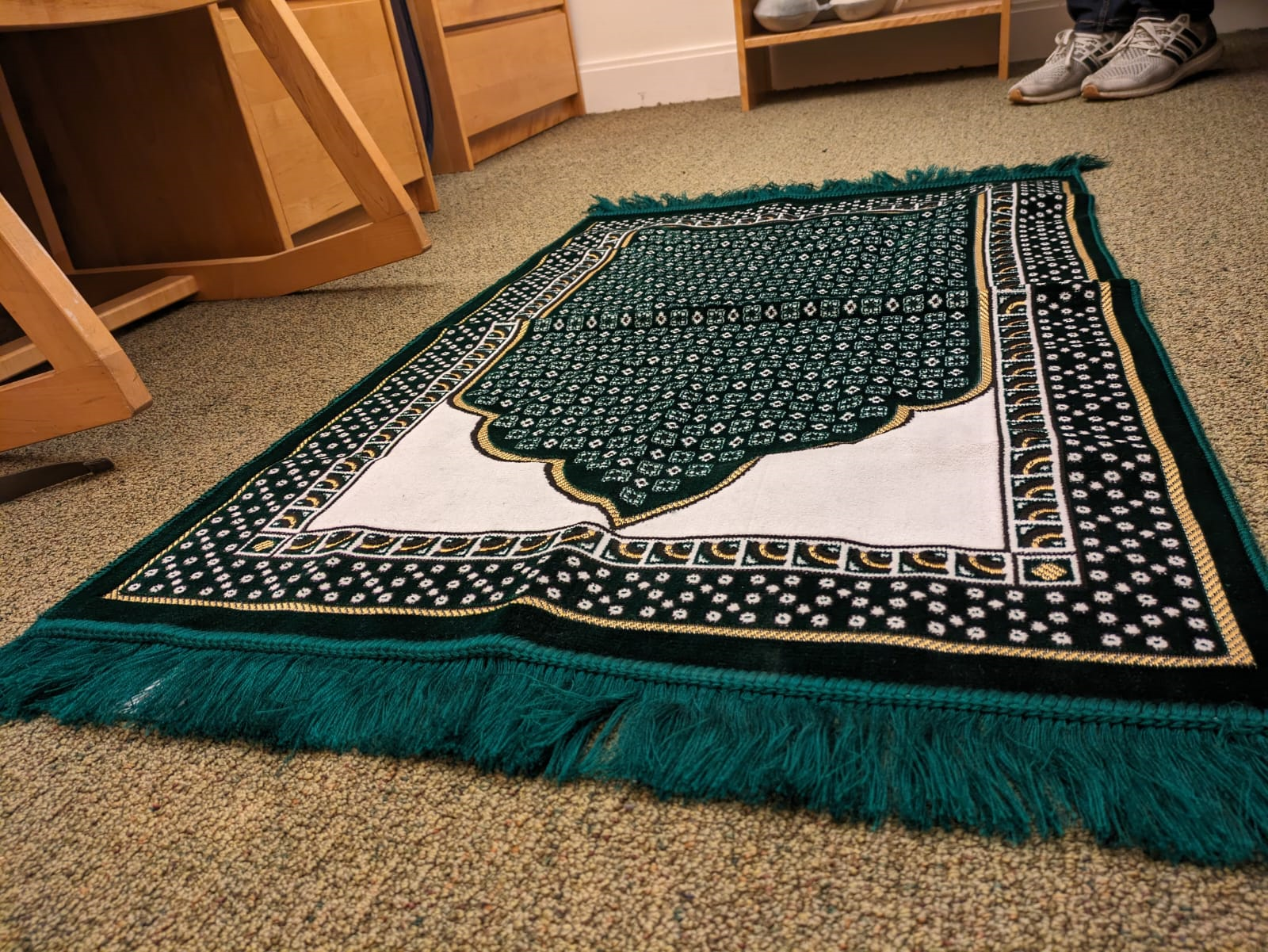 "An intricately woven prayer mat used by Muslims for daily prayers."

- Ahmad