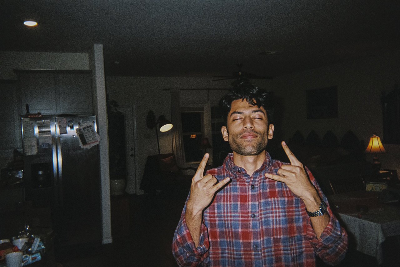"This is a picture of one of my cousins took on his disposable camera while I threw up the signs to rock on and closed my eyes because of the flash. Surprisingly, it captures a core practice of Islam that I practice daily: to have faith in God and en