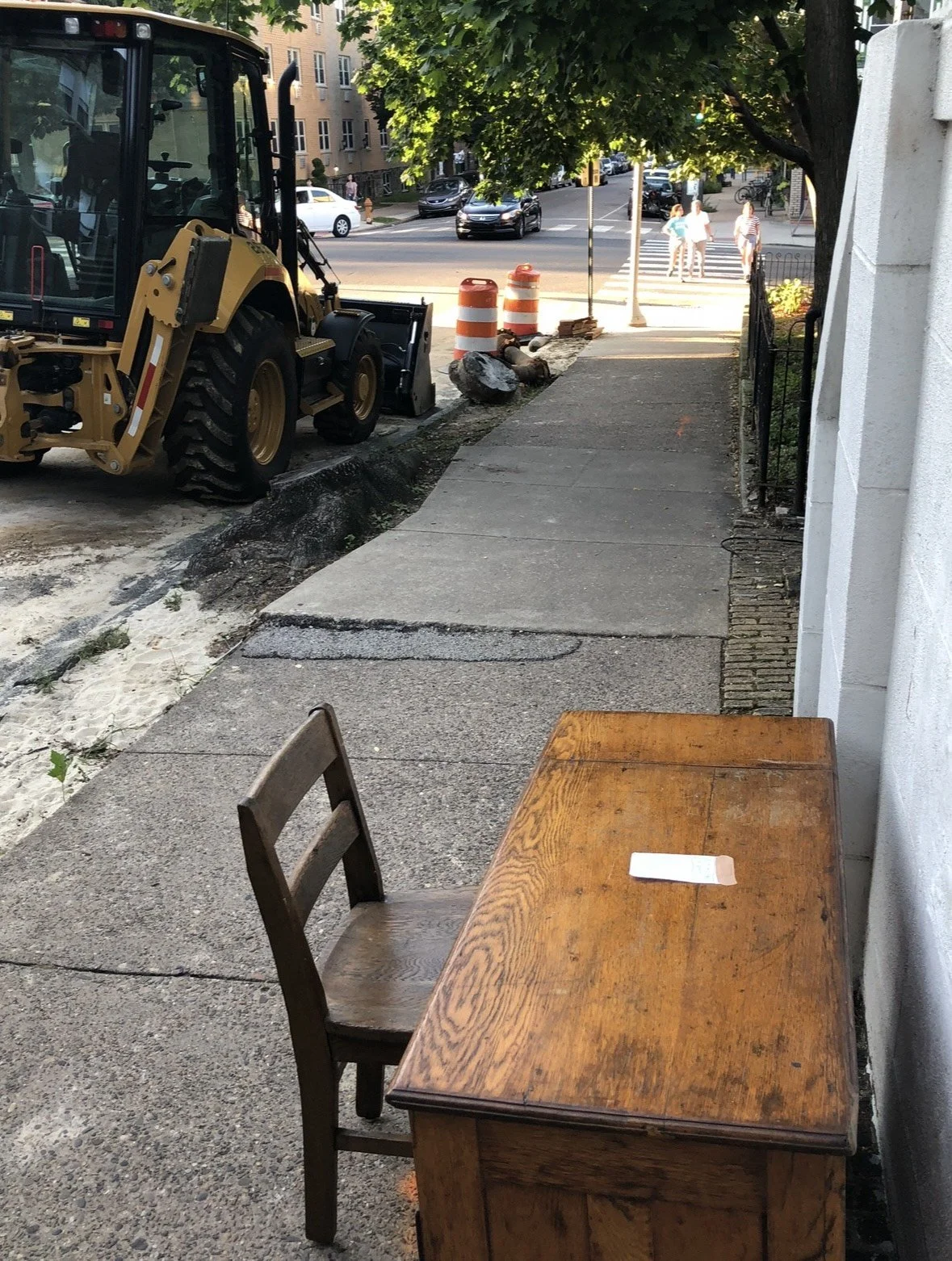 This picture, it was just garbage on the street, but it's like inviting you to sit down and write your story. I mean, it was someone throwing away this desk and even just this whatever power tool over here that's destroying or constructing or somethi