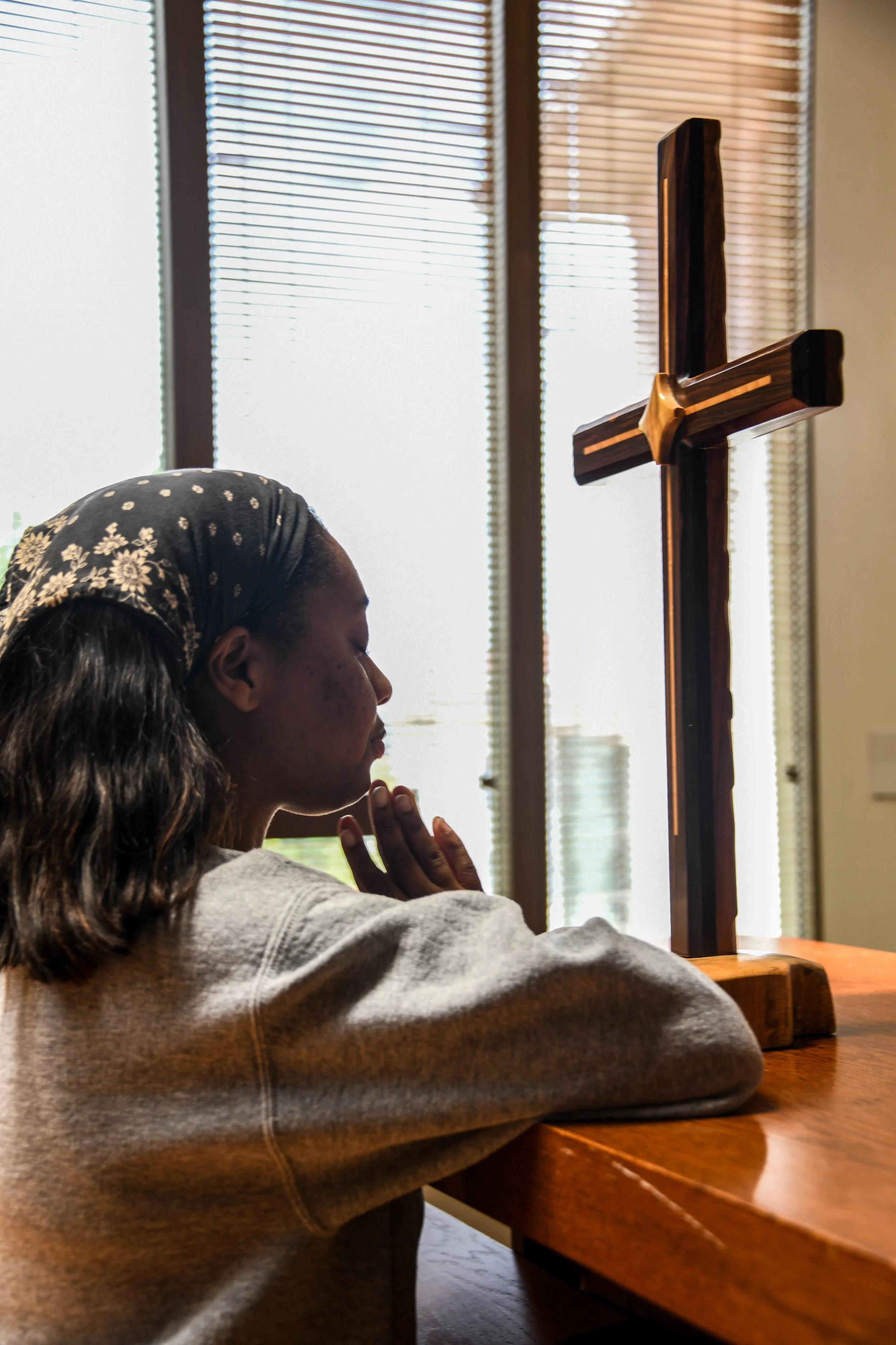 This is inside the chapel that we use for the school chapel at my school. And it is another of my coworker that does a lot of praying. Praying is how she practices her spirituality. And I really like the contrast of this image and just how connected 