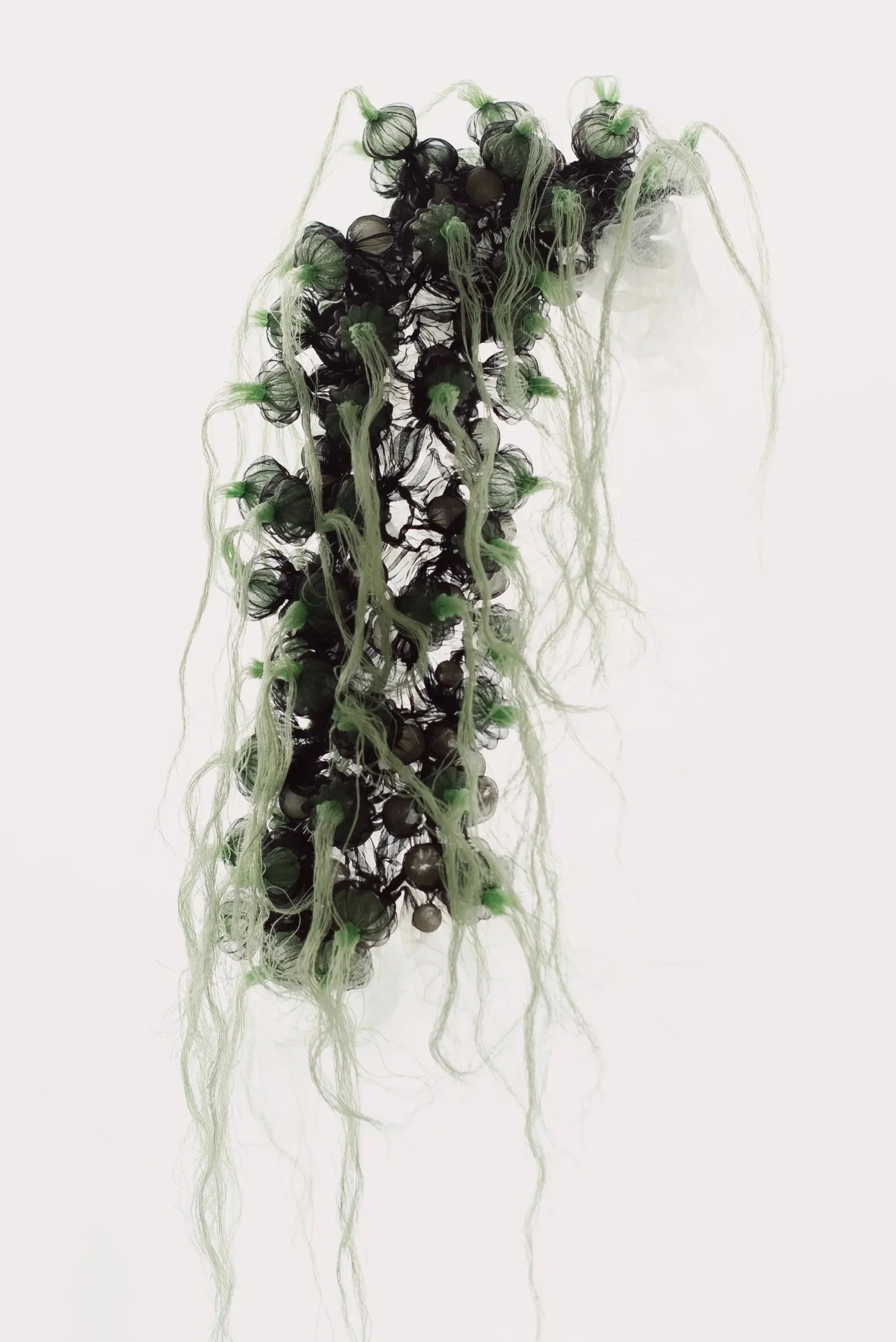 Heat-manipulated organza with stitches