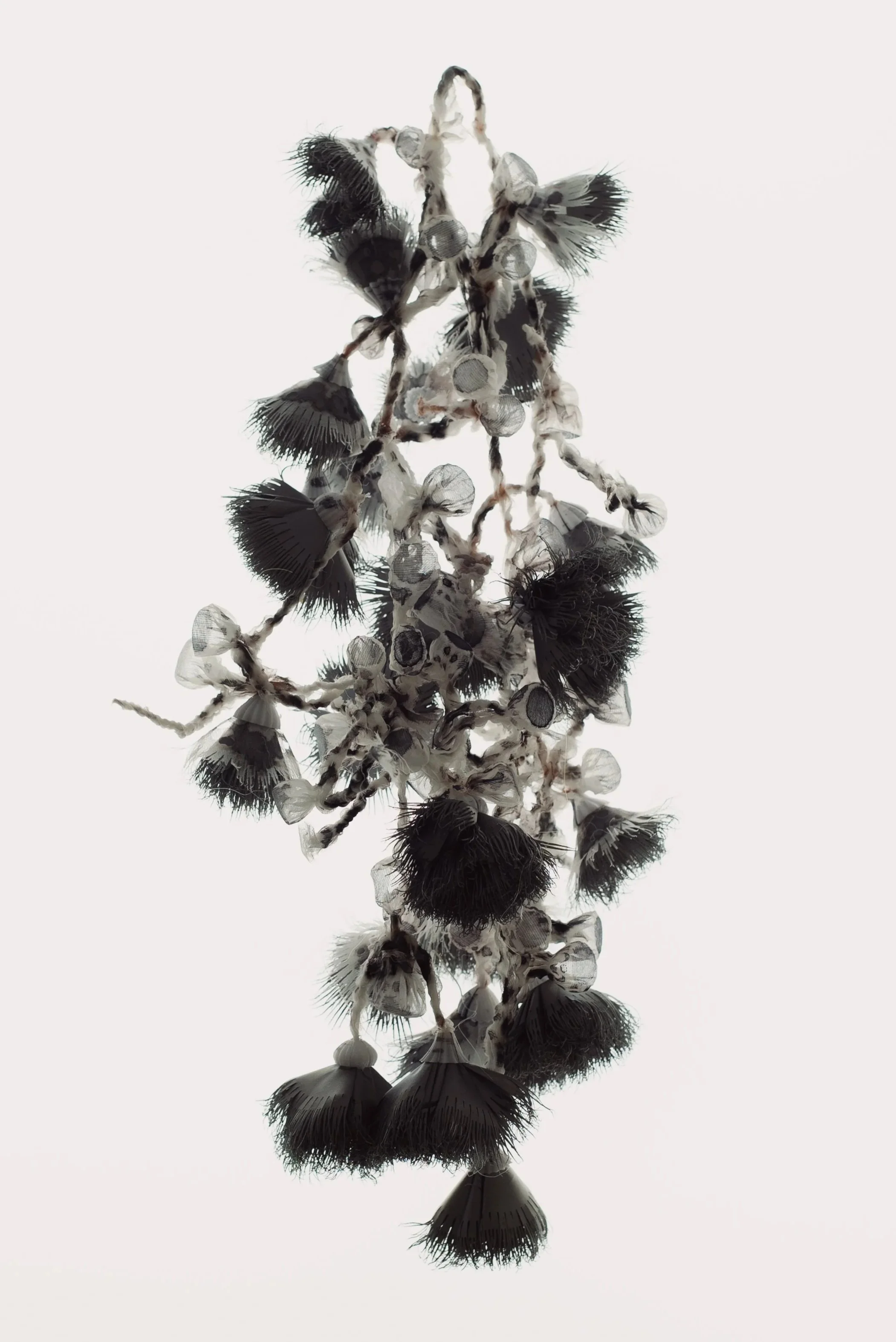 Painted, lasercut and heat-manipulated  organza and reflective textile