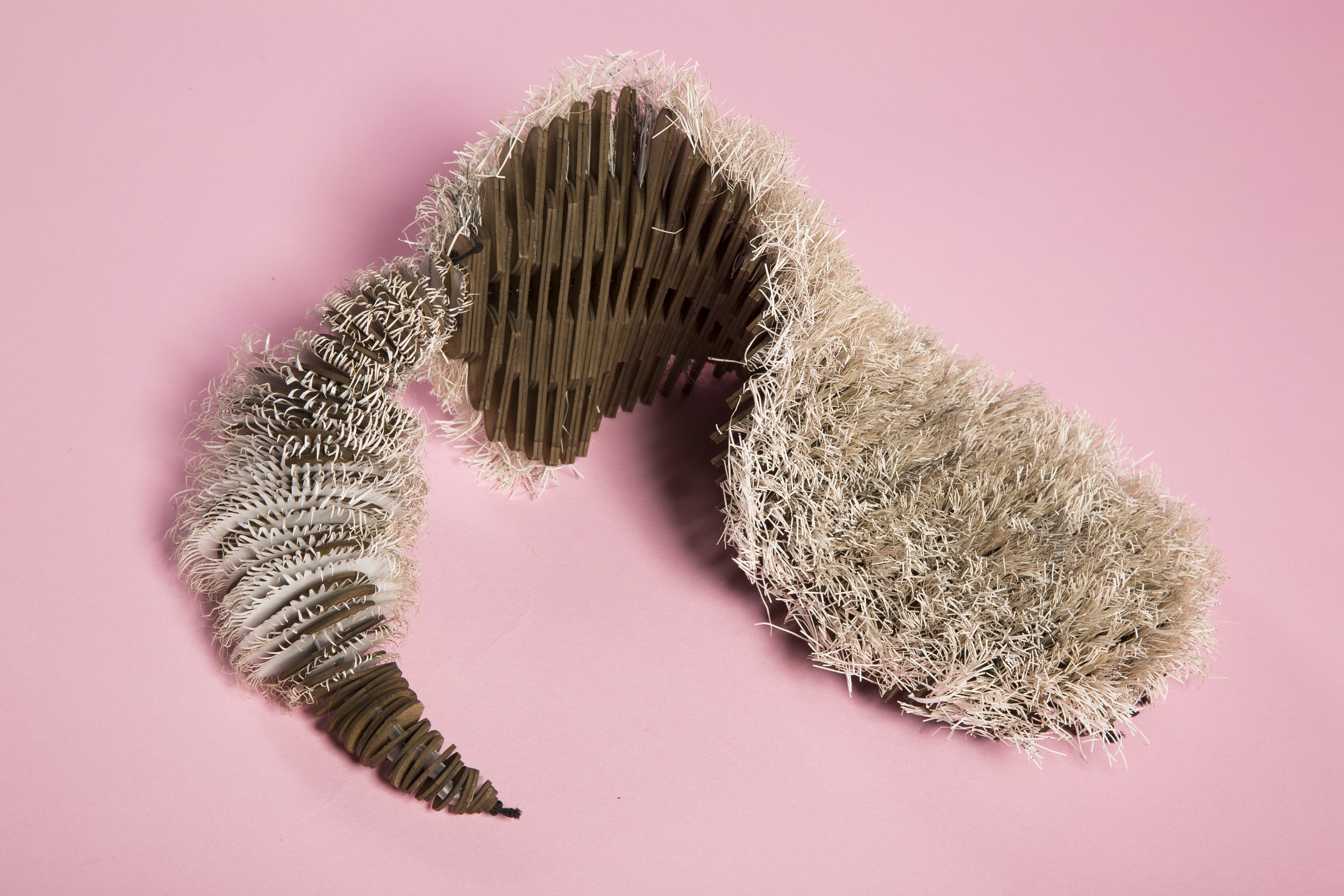 Paper mini furs, a collection of lasercut furs made of recycled print paper