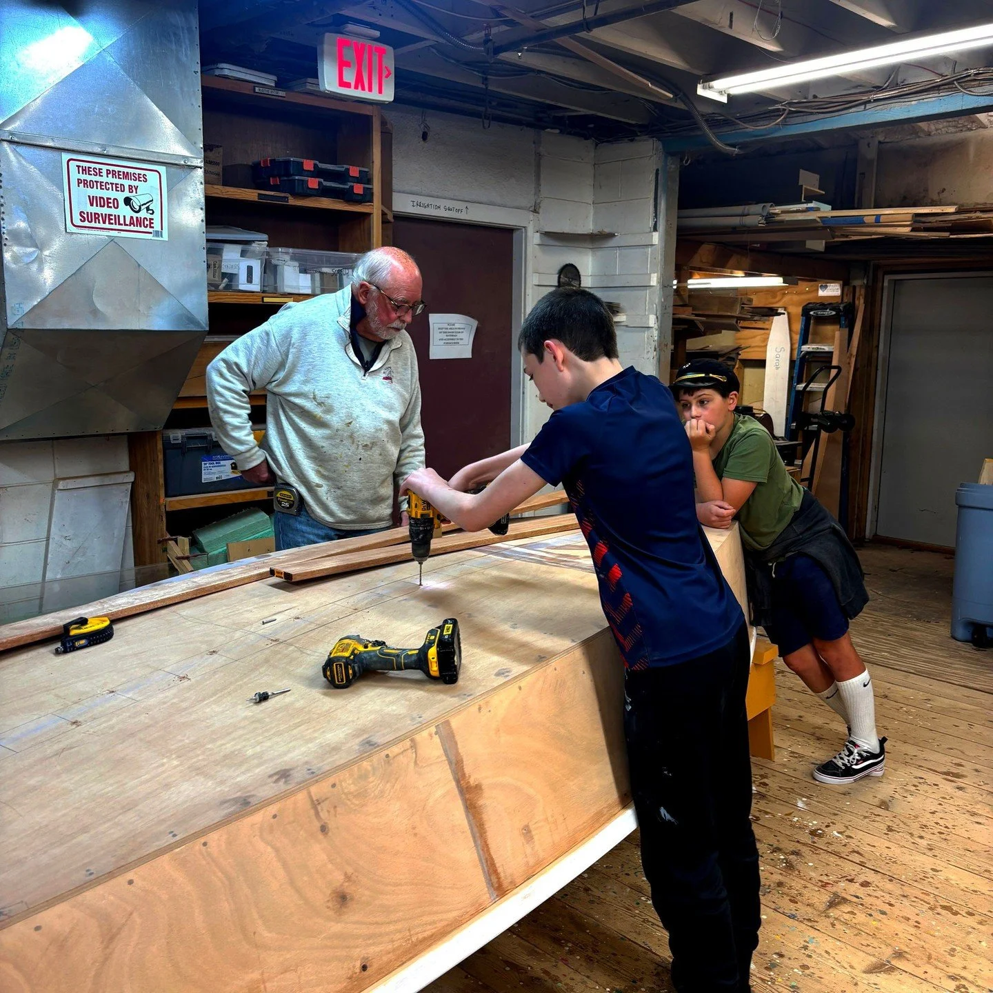 A few of our star boatbuilding students from recent years were invited back to help our volunteers work on the boat that will soon be displayed in front of the JFK Museum!

Here they are hard at work alongside our Thursday night boatbuilding voluntee
