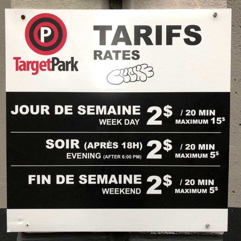 Rates banner around the Montreal Academy of the Metal Arts building