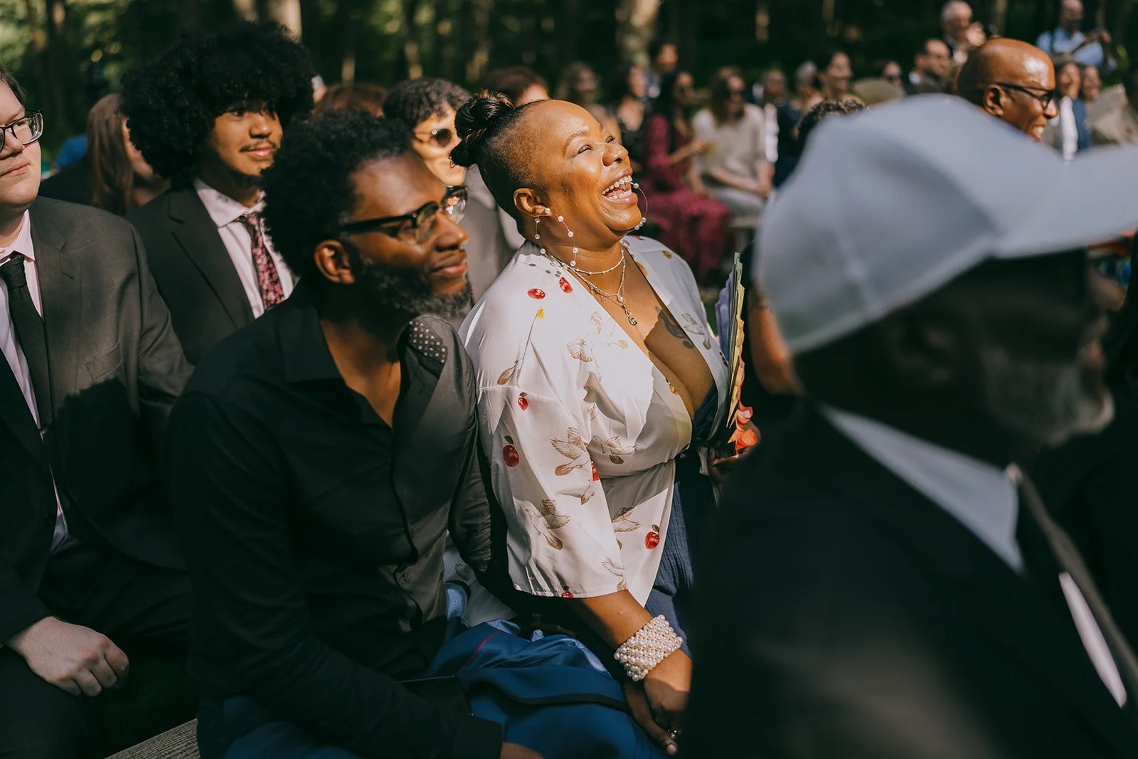 Wedding guests smiling and laughing during the personal Hudson Valley wedding ceremony officiated by modern wedding officiants from Once Upon A Vow