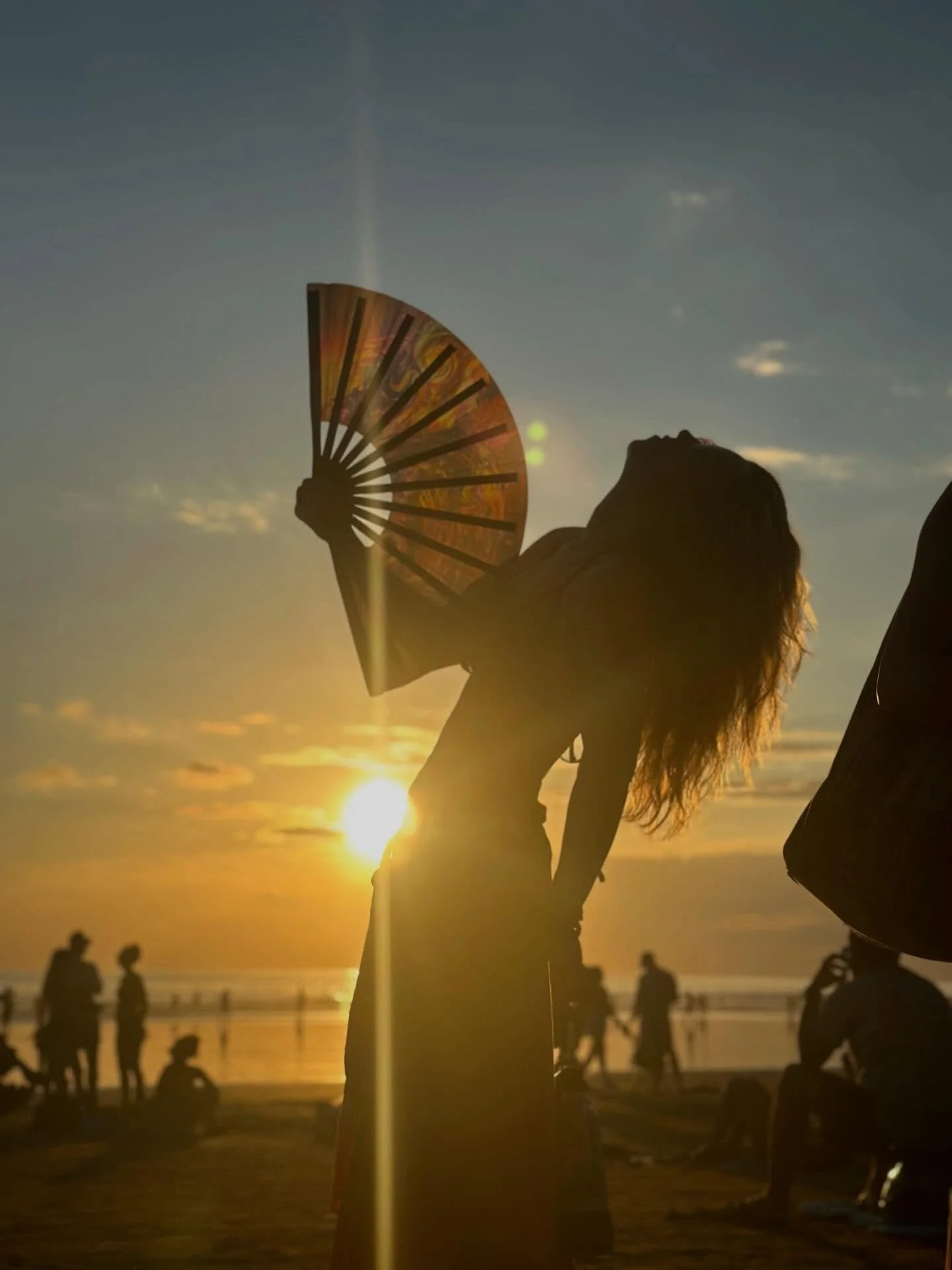 When I came to my first Envision, someone handed me a festival fan.

You know the ones. Plastic. Synthetic. A little flimsy.
And yet when you snap it open on the beat of the music, the crack cuts through the air like percussion.

There is nothing lik