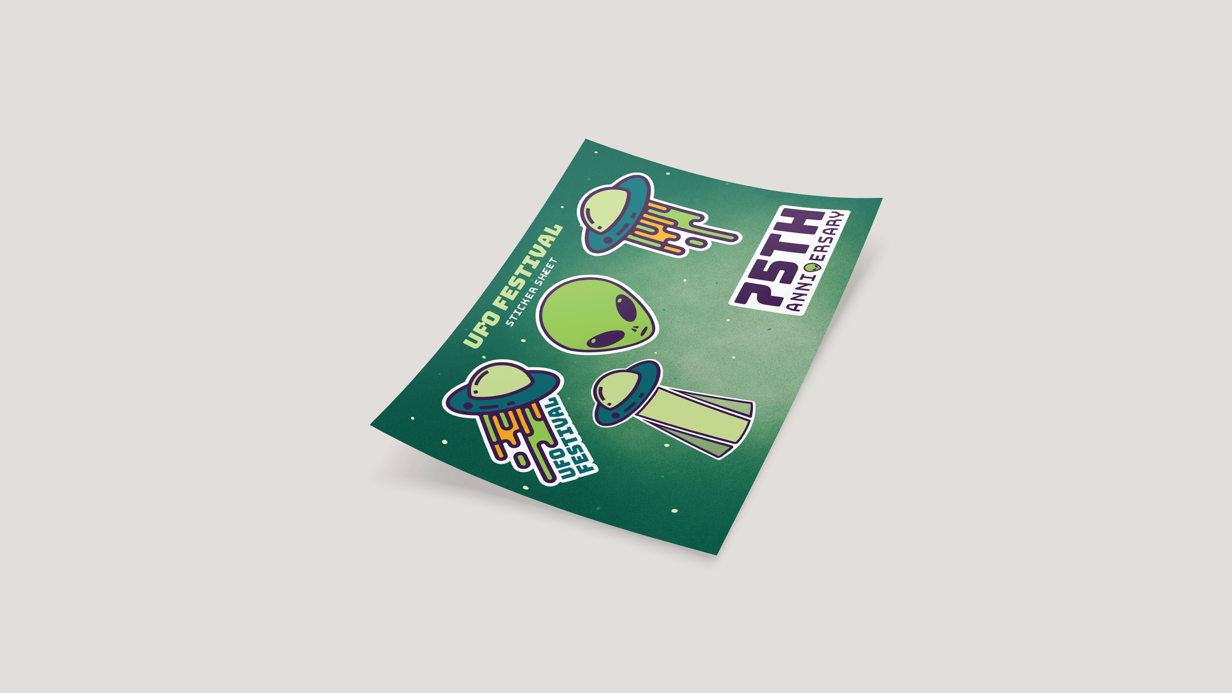 A sticker sheet design of some of the major imagery in this rebrand. The stickers on the sheet consists of the logo, the logo without the text, the alien head, the ufo with rays from the poster, and a "75th anniversary" typography based design.