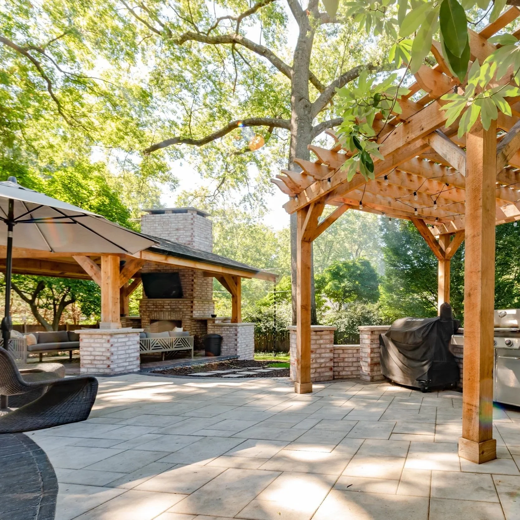 Custom pavilion and pergola shading a Kansas City hardscape from the overhead sun