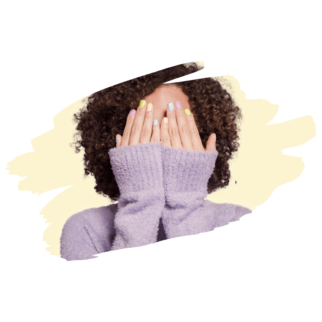 [Image] BIPOC young adult covering their face vulnerably, representing identity exploration and emotional support in Colorado young adult group therapy at Interfaith Bridge Counseling.