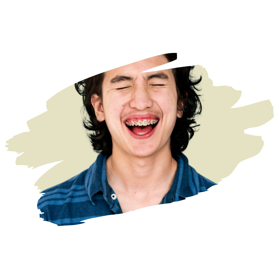 [Image] High school male teen laughing with braces representing connection and confidence in teen group therapy in Denver, Colorado at Interfaith Bridge Counseling.