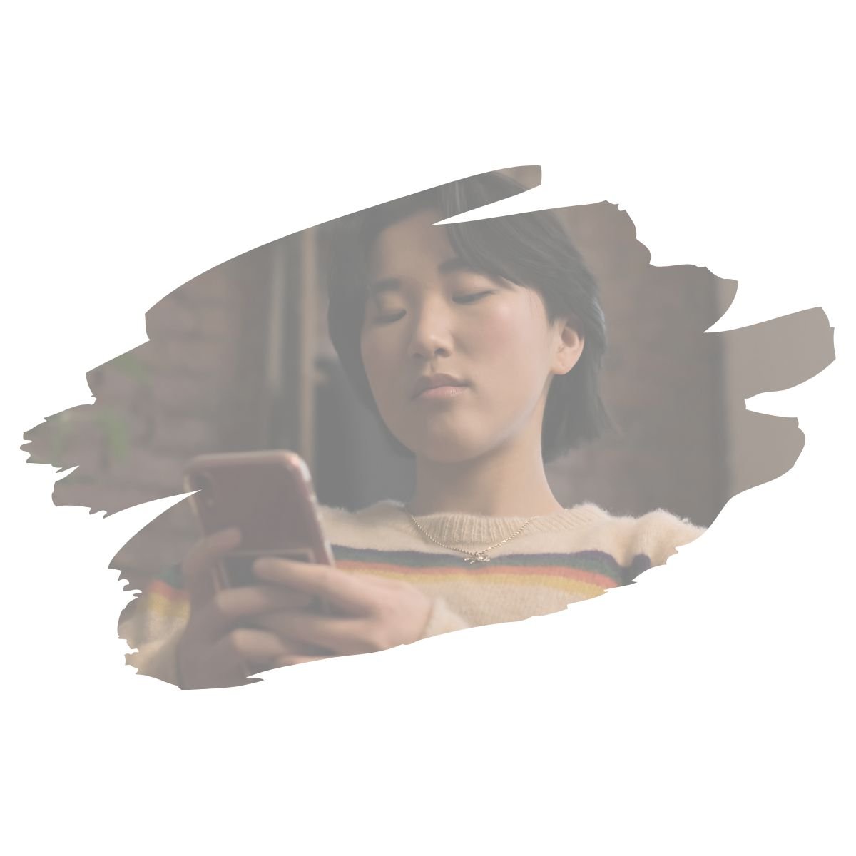 Asian teen looking at their phone, illustrating ECN and DMN brain modes in decision-making, therapy for teens and young adults in Denver, CO