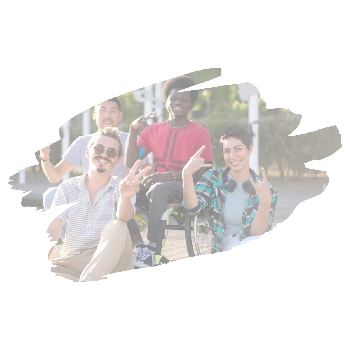 Diverse group of young adults of all ethnicities and abilities smiling outdoors together, illustrating expanded window of tolerance and connection, therapy for teens and young adults in Denver, CO.
