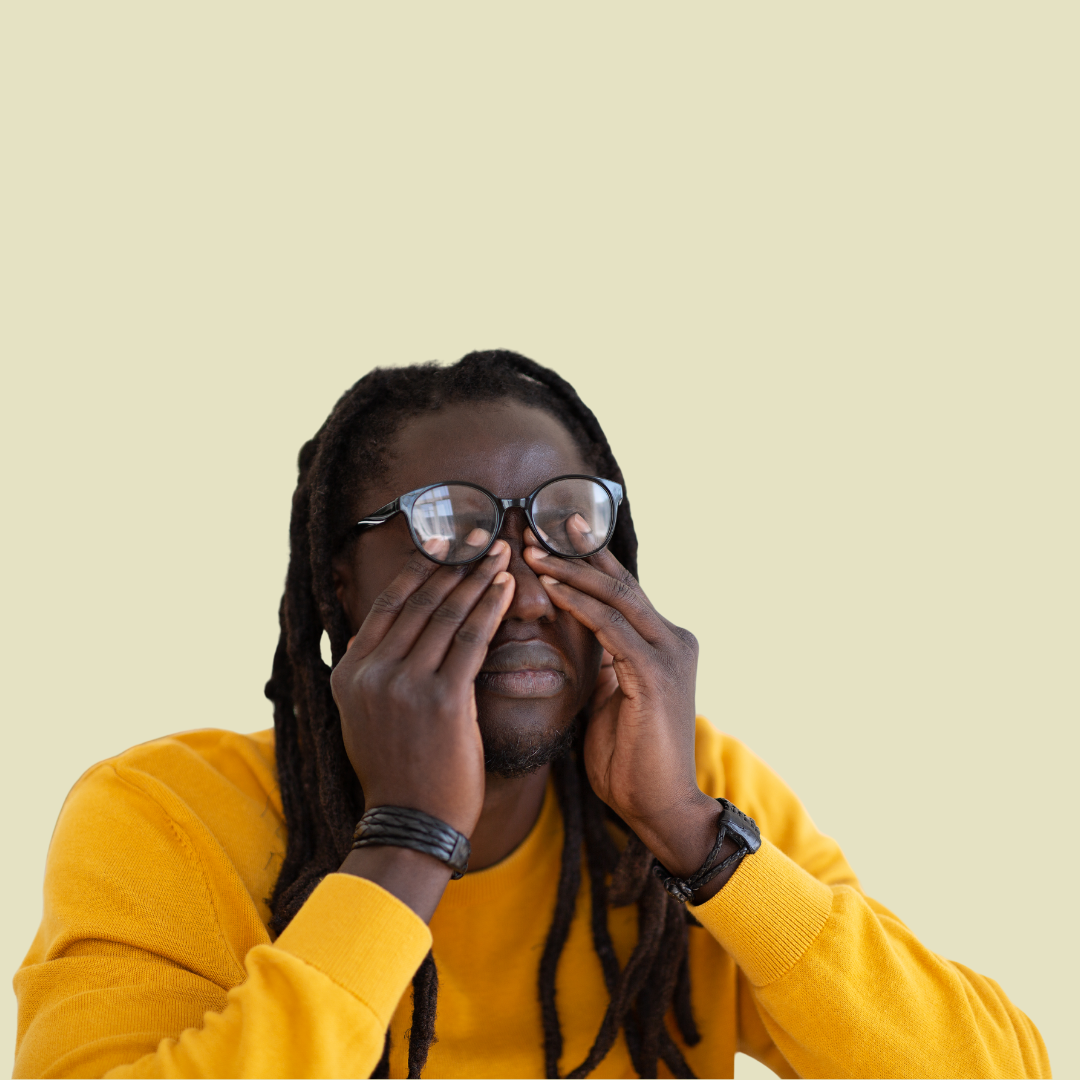 [Image] Young adult black male with glasses in yellow shirt, rubbing eyes out of frustration. Denver Teen Therapy for Stress..