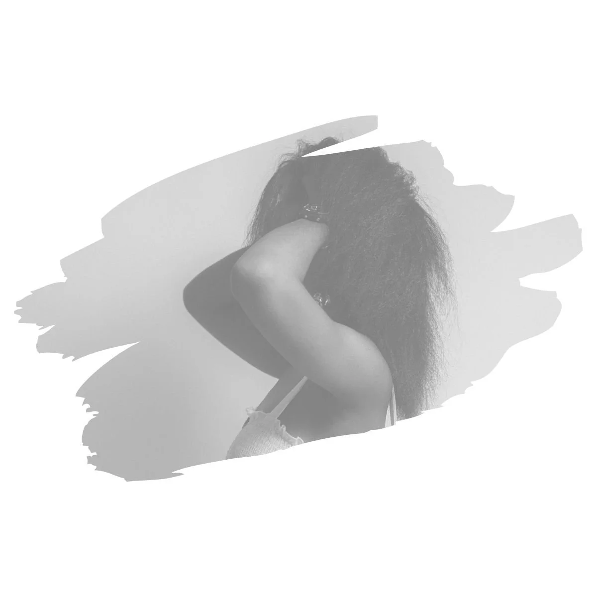 [Image] Young black woman in black and white, grabbing her head and hair, representing identity loss and enmeshment therapy for teens and young adults in Colorado. Interfaith Bridge Counseling.