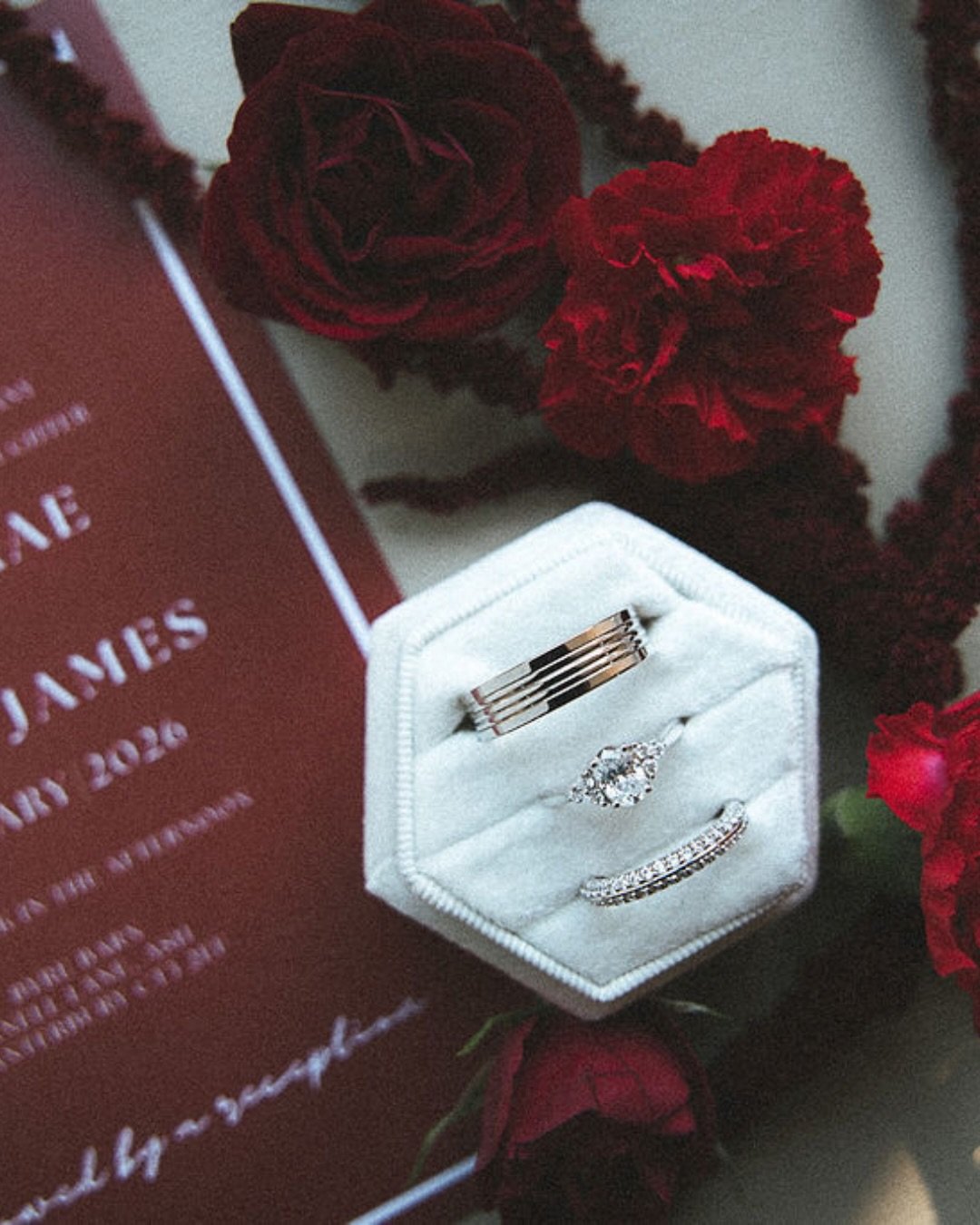 Fancy some wedding ring inspiration? 
A knife-edge diamond setting. Instead of being rounded or flat across the top, two rows of diamonds meet in a subtle central ridge with a strip of metal running around the ring. 

The ridge catches the light, so 