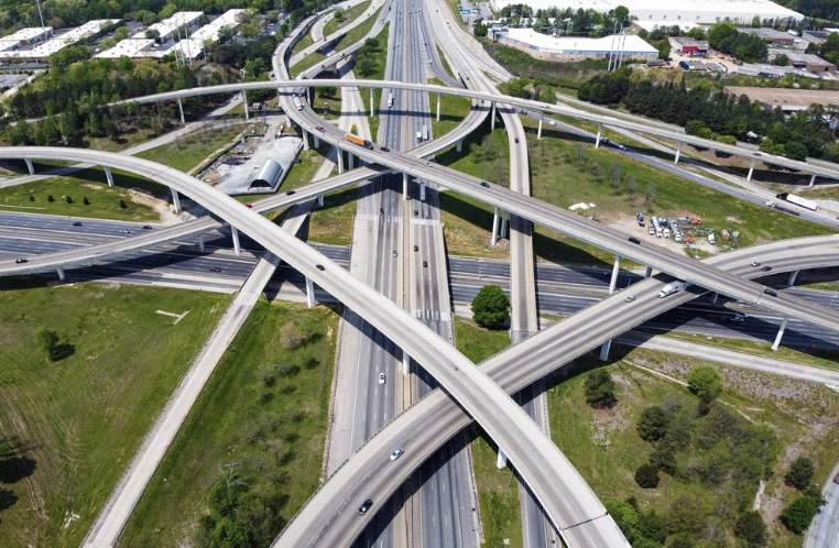 Aerial view of a complex highway interchange with multiple overpasses and ramps