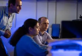 Students intently looking at a computer screen