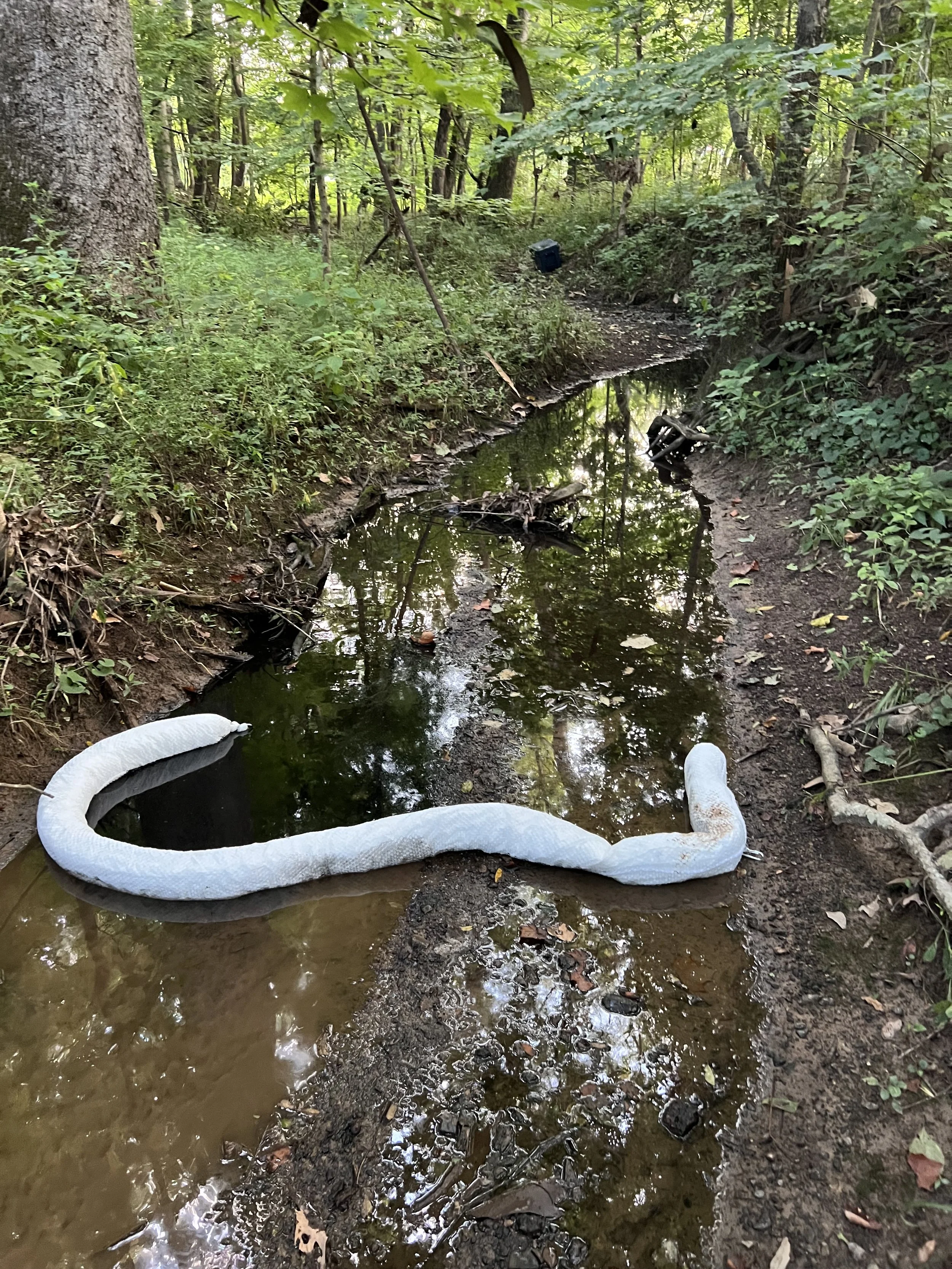 Fuel &amp; Oil Spill Cleanup in Creek on Bethesda Road | Enviro Medics Hazmat Team