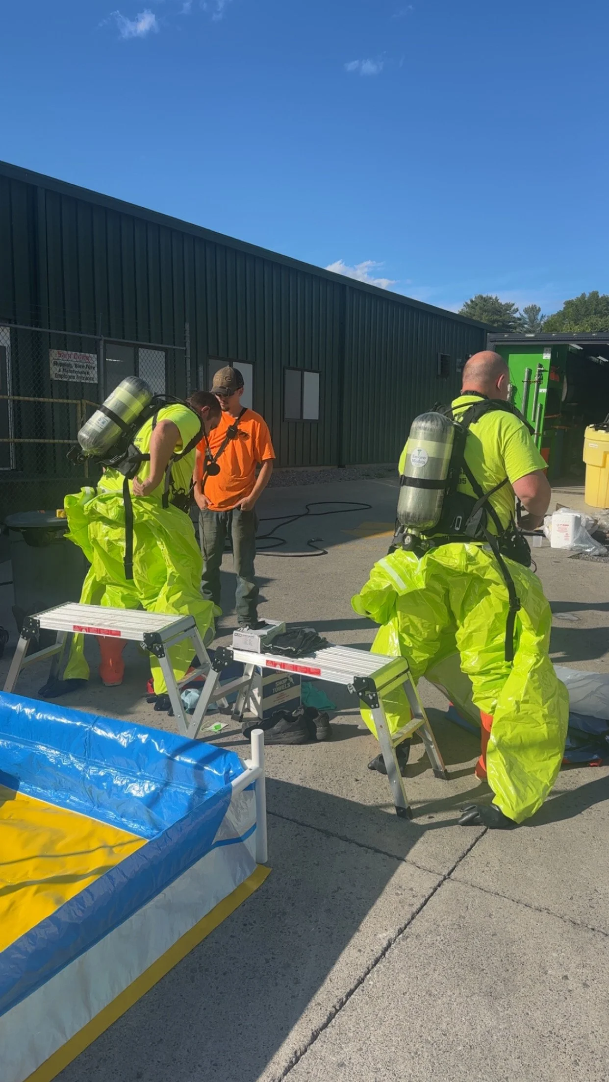 Enviro Medics emergency spill response team donning Level A PPE and SCBA prior to hazardous materials mitigation in Kingsport, Tennessee.