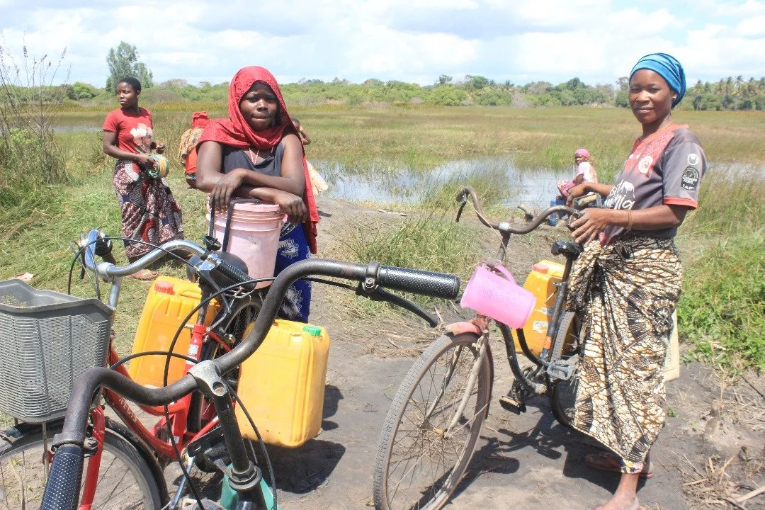 Women fetching water to the existed water source-Malungo.jpeg