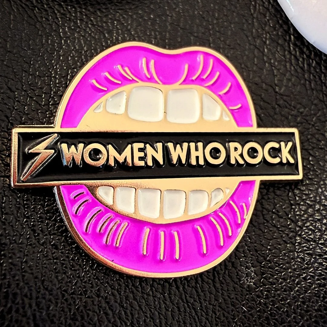 💥 NEW DROP ALERT 💥 Meet the Women Who Rock Bite Back Enamel Pin 🫦⚡️

Bold. Hot pink. Rock &rsquo;n&rsquo; roll with a purpose.

This pin is for every woman who owns her voice, stands her ground, and shows up unapologetically. Wear it on your jacke