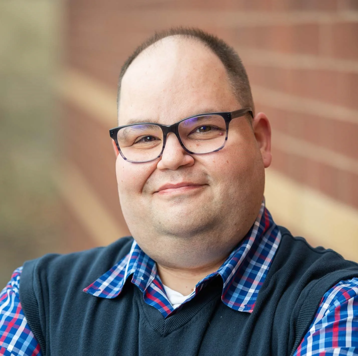 A profile picture of John Siracusa, One Voice's Engagement and Development Coordinator