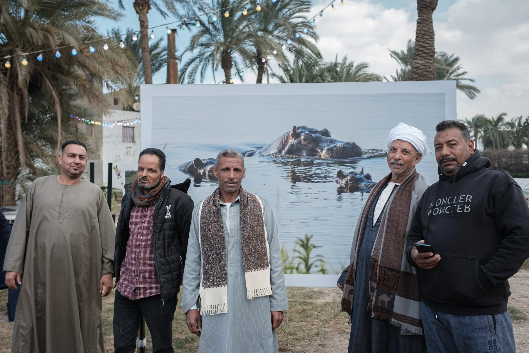 One image showed a hippopotamus in Rwandan waters. A group stood before the life-sized photo, taking pictures with their phones. They started talking about how hippos once lived in the Nile in Egypt before the dam was built. Photo Credit: Aly Hazzaa
