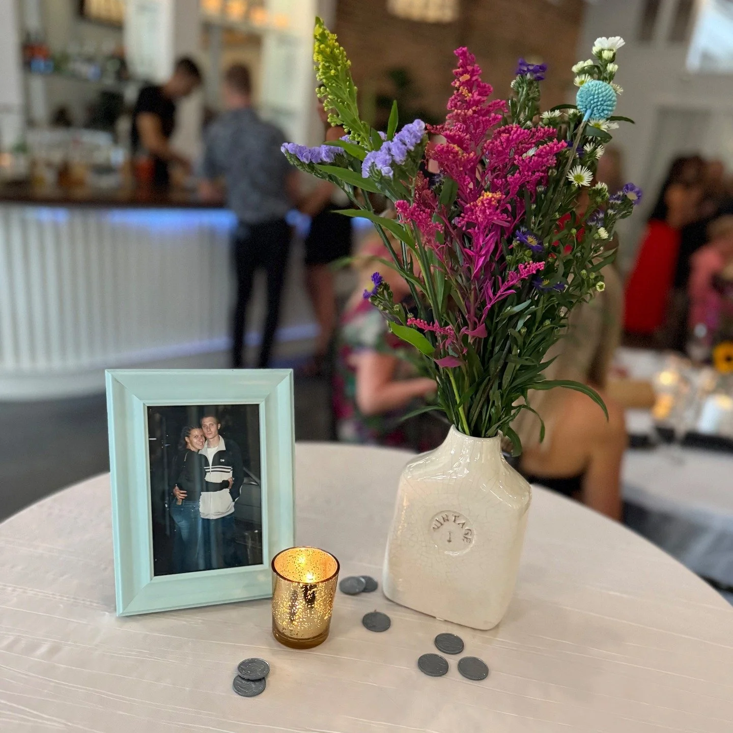 A photo from the beginning, fresh flowers, candlelight, and family all around &mdash; the perfect way to honor 25 beautiful years together. 💕🥂

Here&rsquo;s to a lifetime more of love and memories. 🌸

Party Coordinator: @parties.made.simple 
Venue